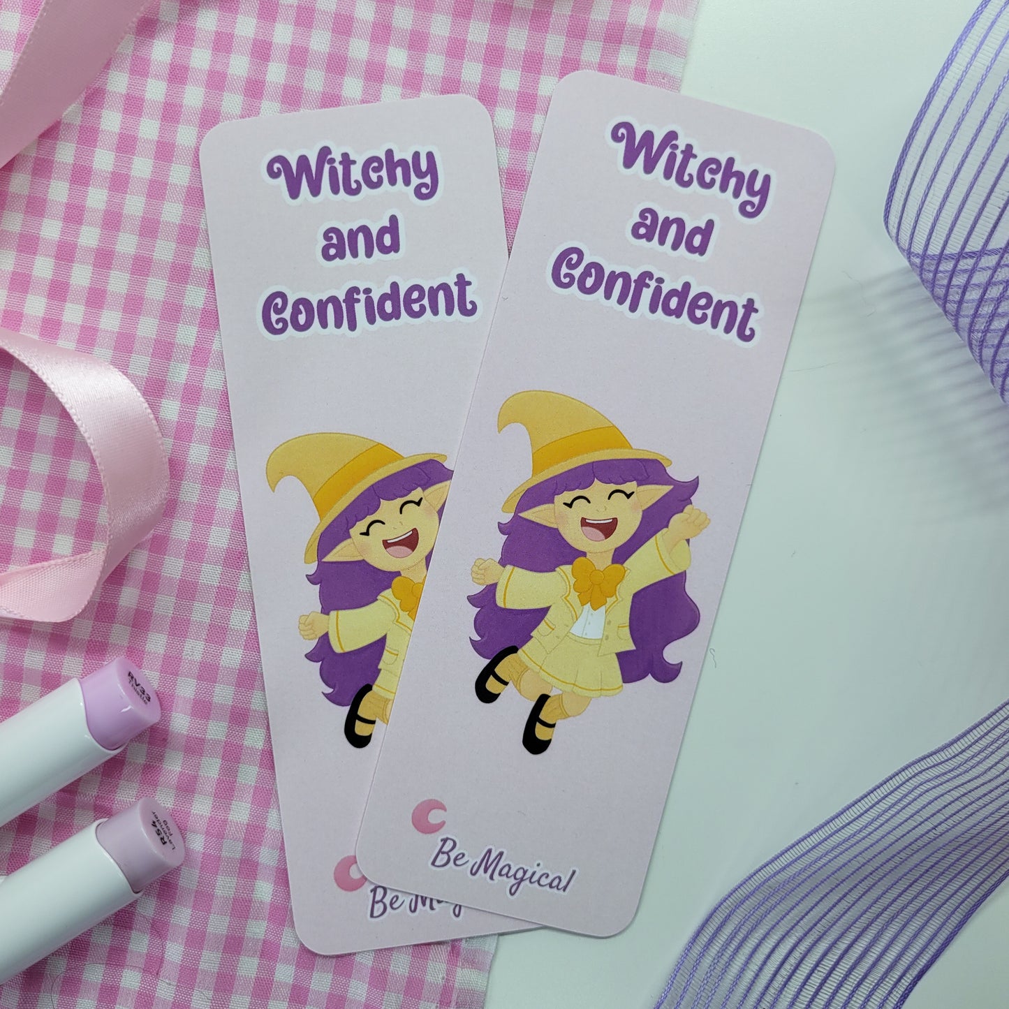 little witch on a bookmark with text witchy and confident