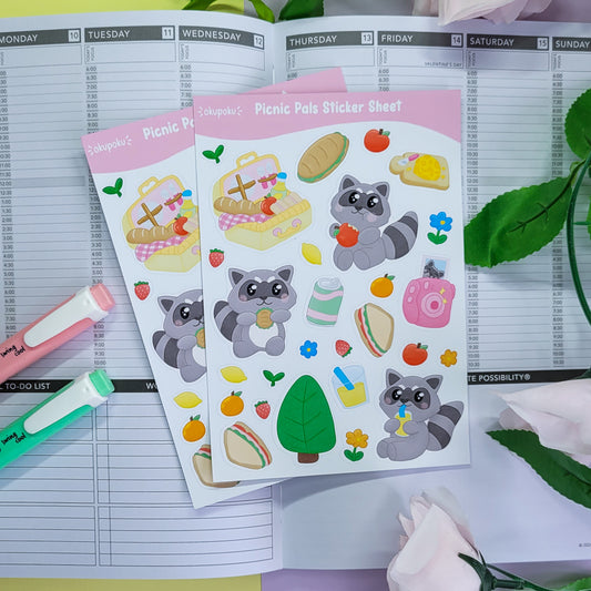 Cute Racoons having a picnic stickersheet featuring lots of food themed stickers too