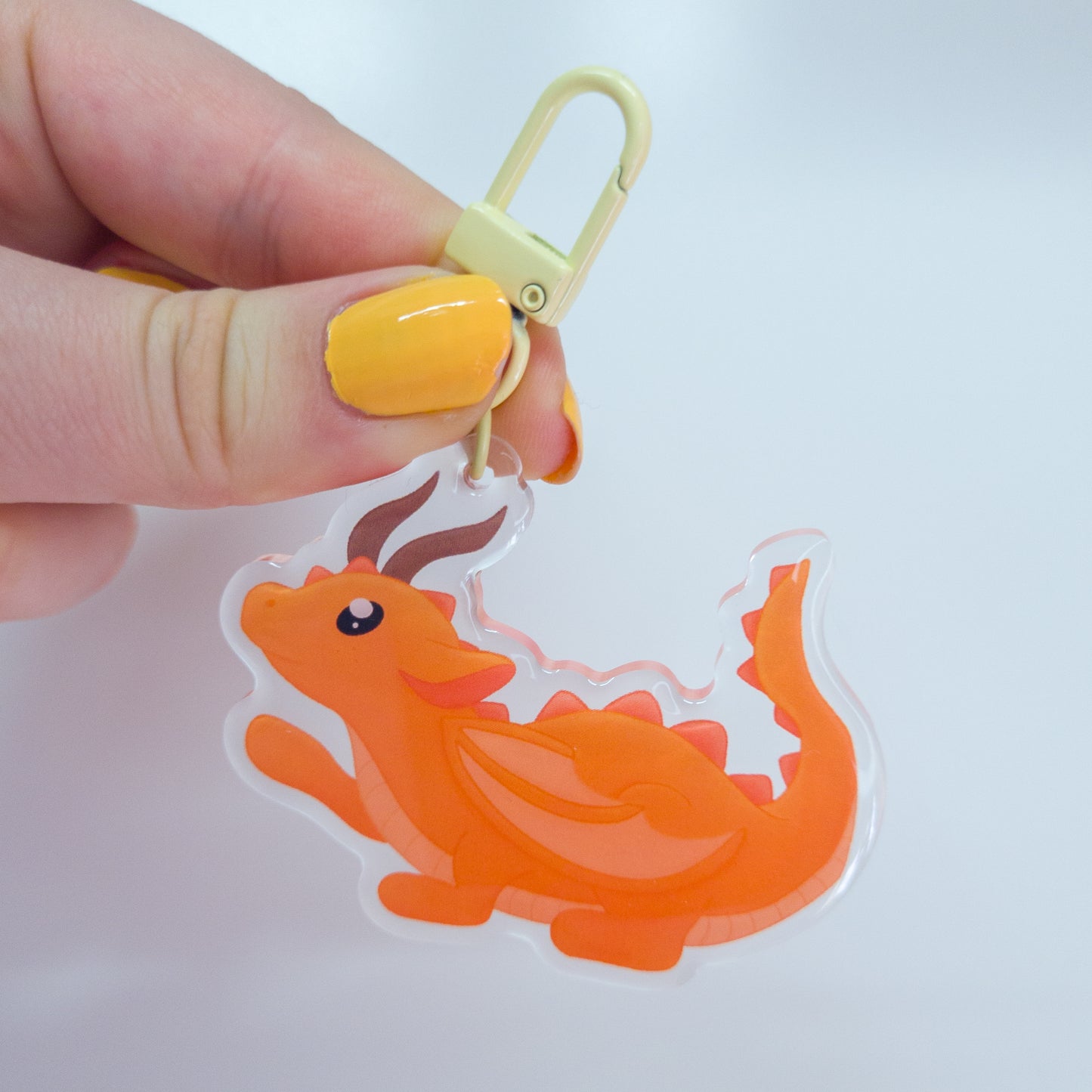 Cute orange forest dragon keychain called mimo