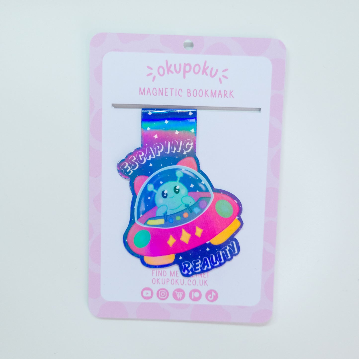 Alien magnetic bookmark featuring the text "escaping reality"