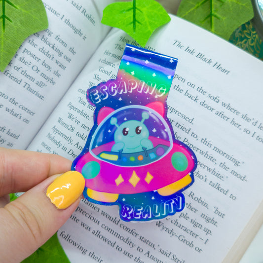 Alien magnetic bookmark featuring the text "escaping reality"