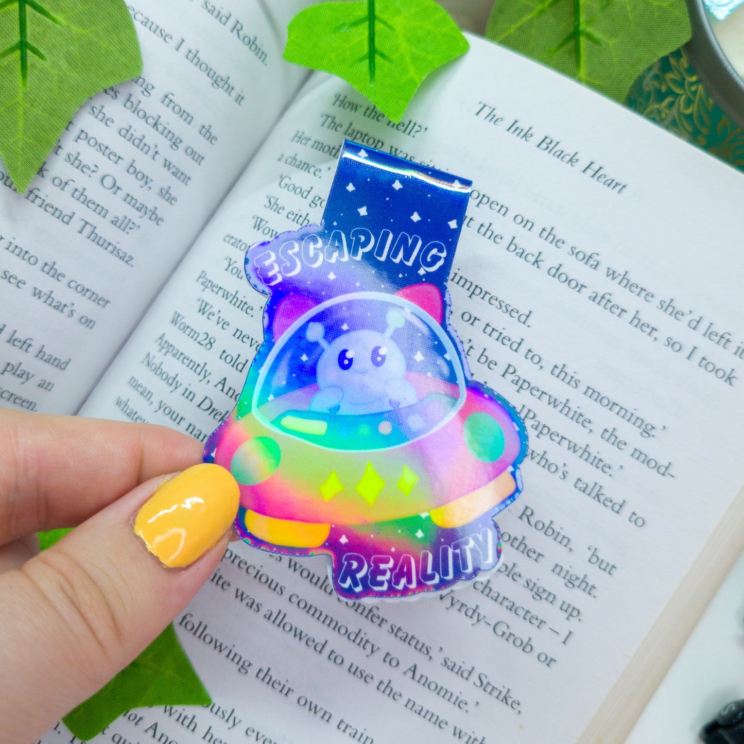 Alien magnetic bookmark featuring the text "escaping reality"