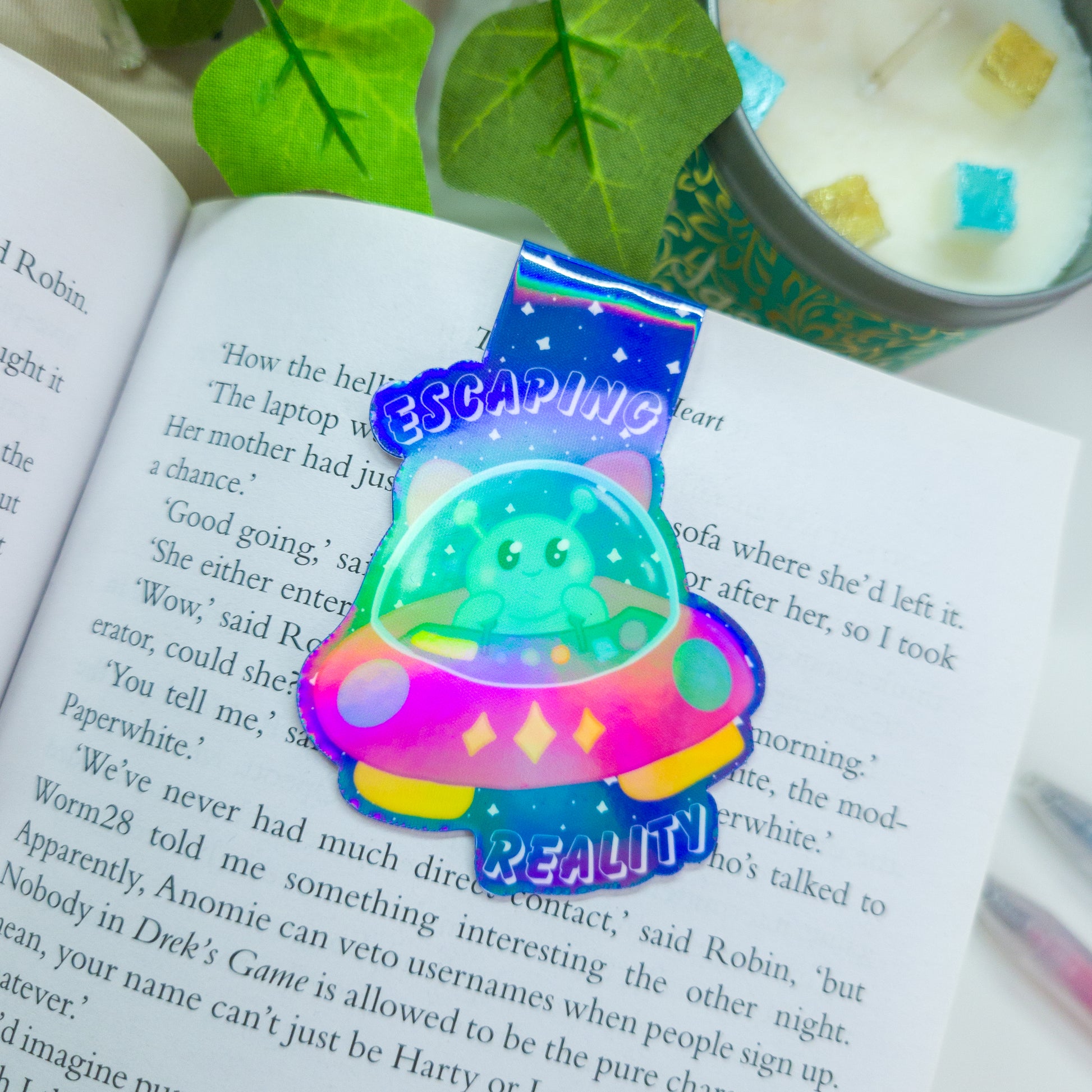 Alien magnetic bookmark featuring the text "escaping reality"