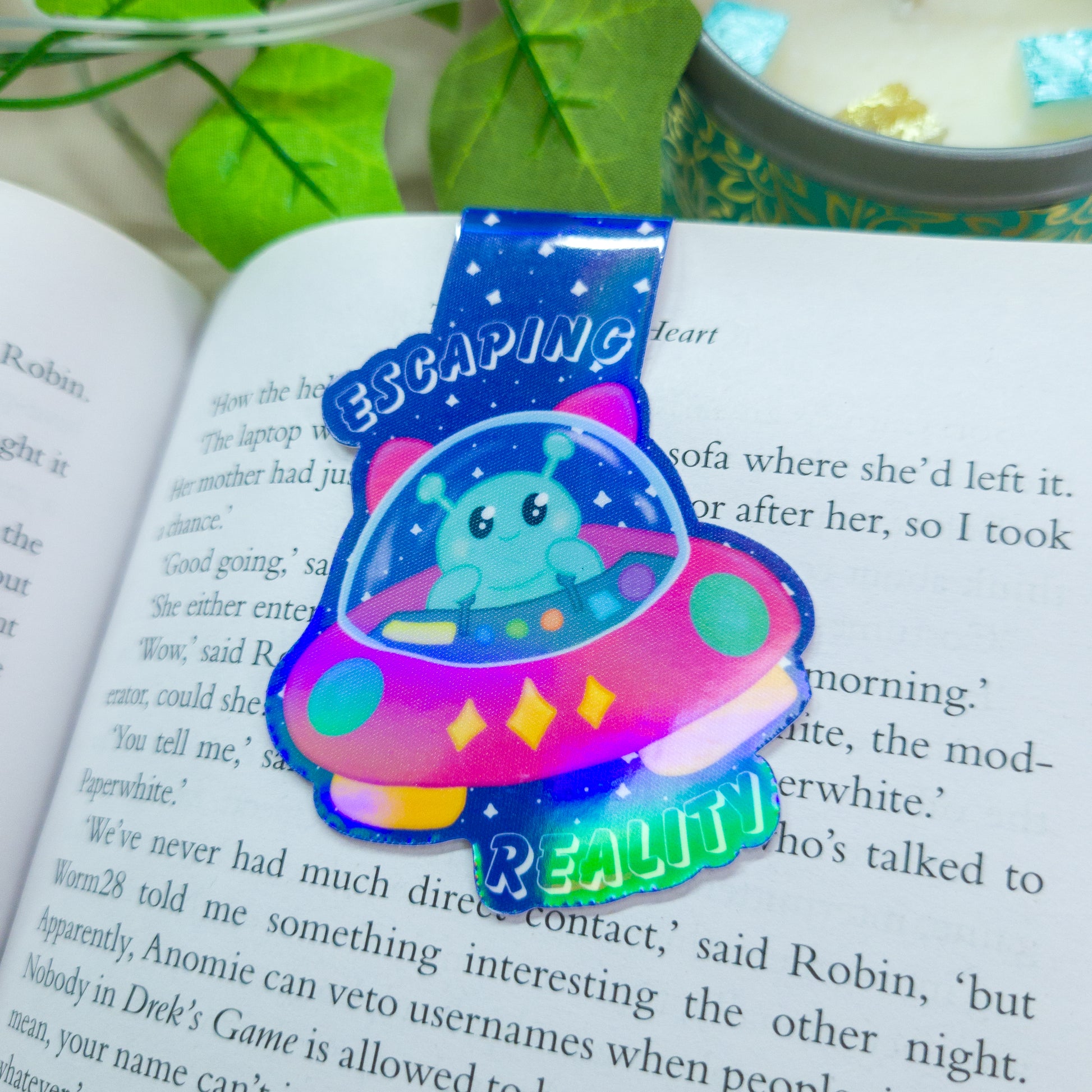 Alien magnetic bookmark featuring the text "escaping reality"