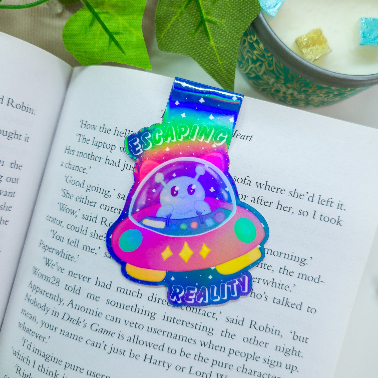 Alien magnetic bookmark featuring the text "escaping reality"