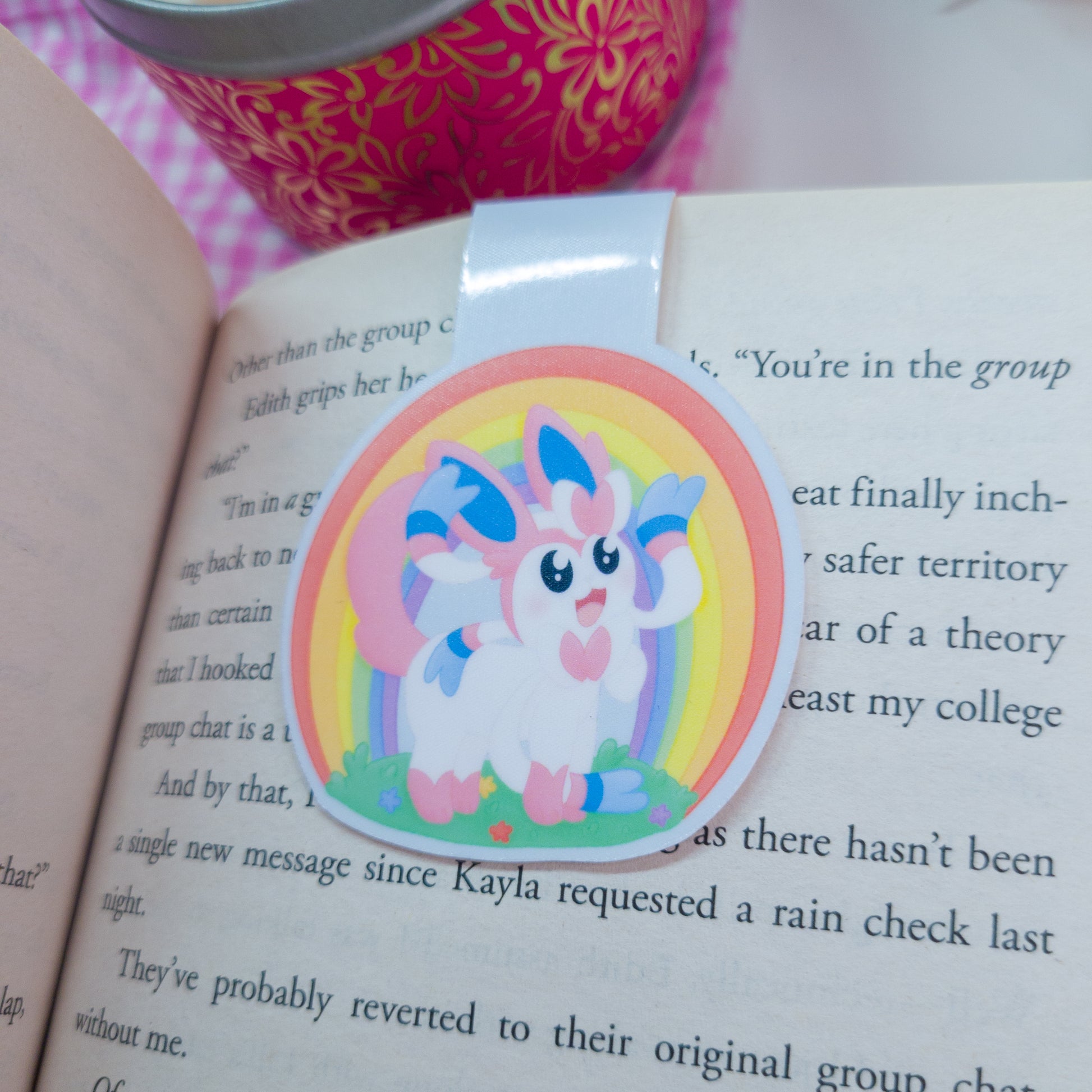 Sylveon magnetic bookmark with a rainbow behind her