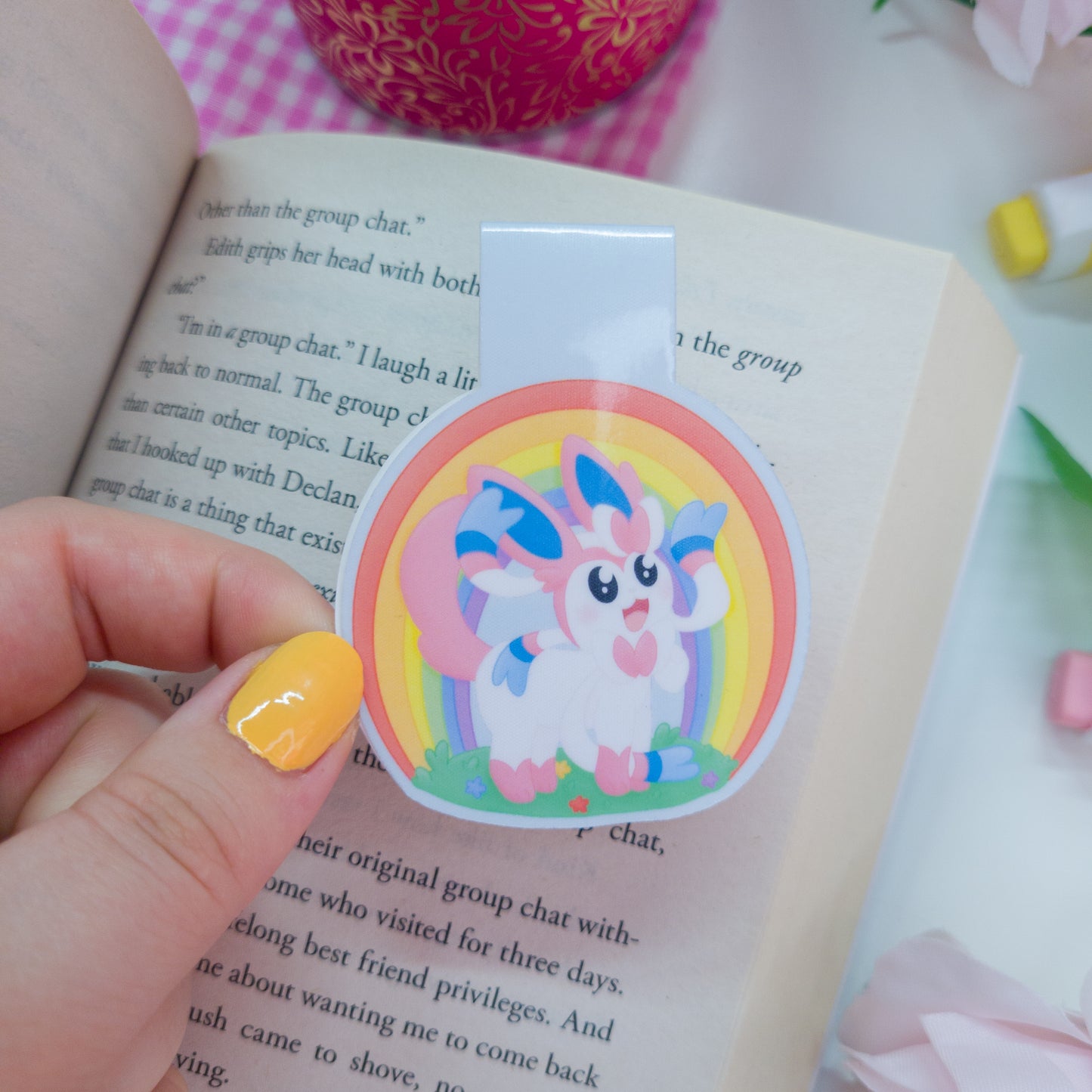 Sylveon magnetic bookmark with a rainbow behind her