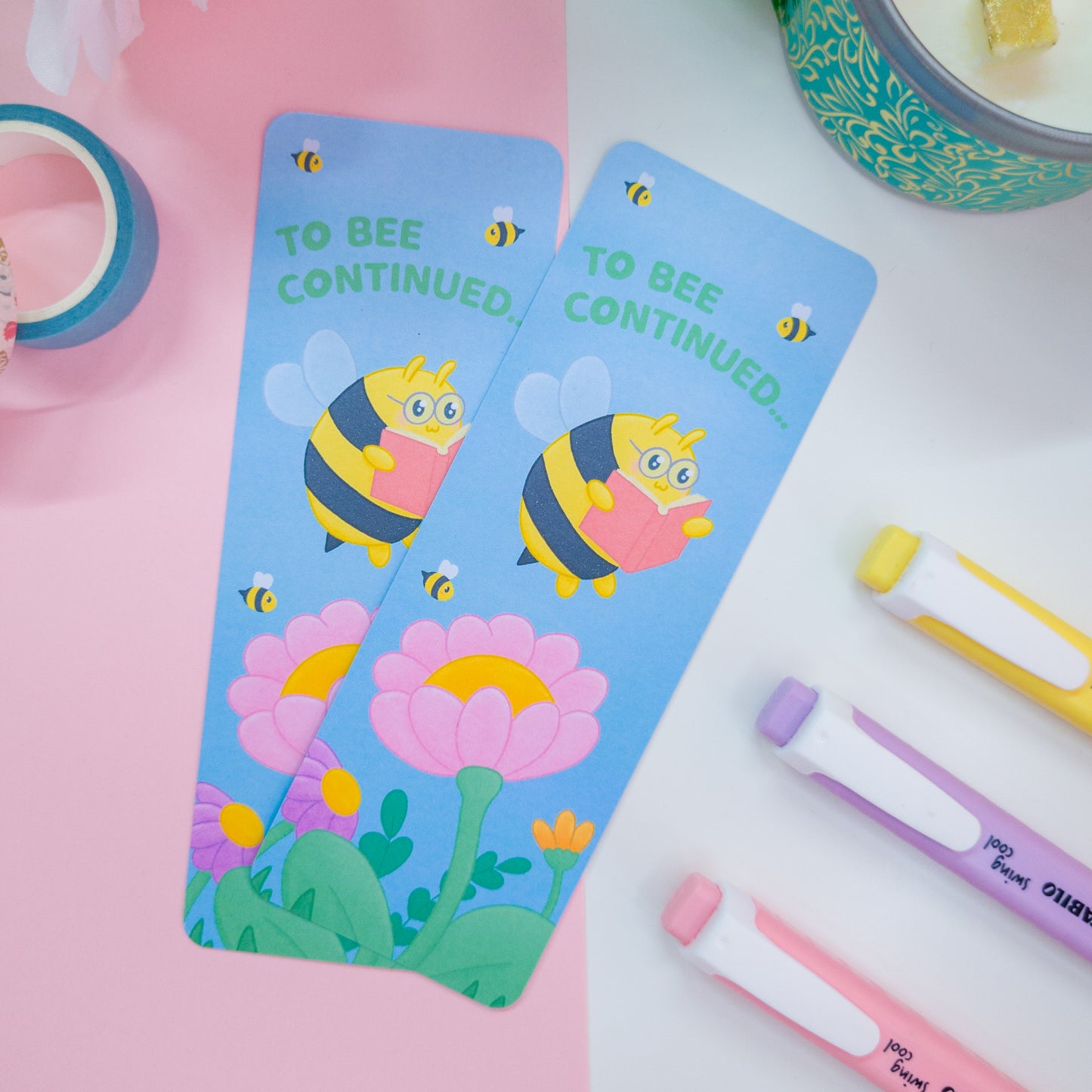 to bee continued bookmark featuring a bee reading among flowers
