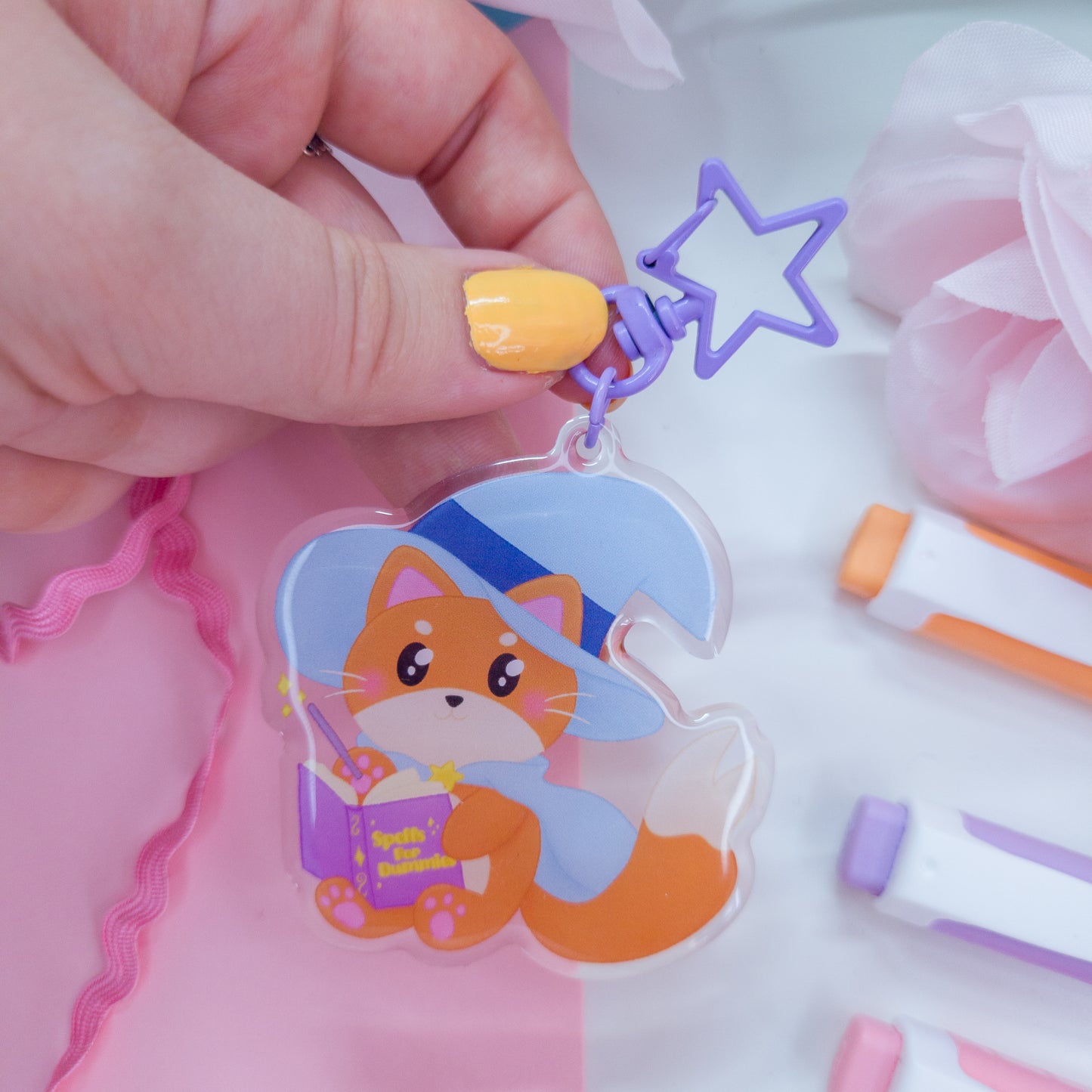 Katrina the kitty witch acryllic keychain with a purple star clasp