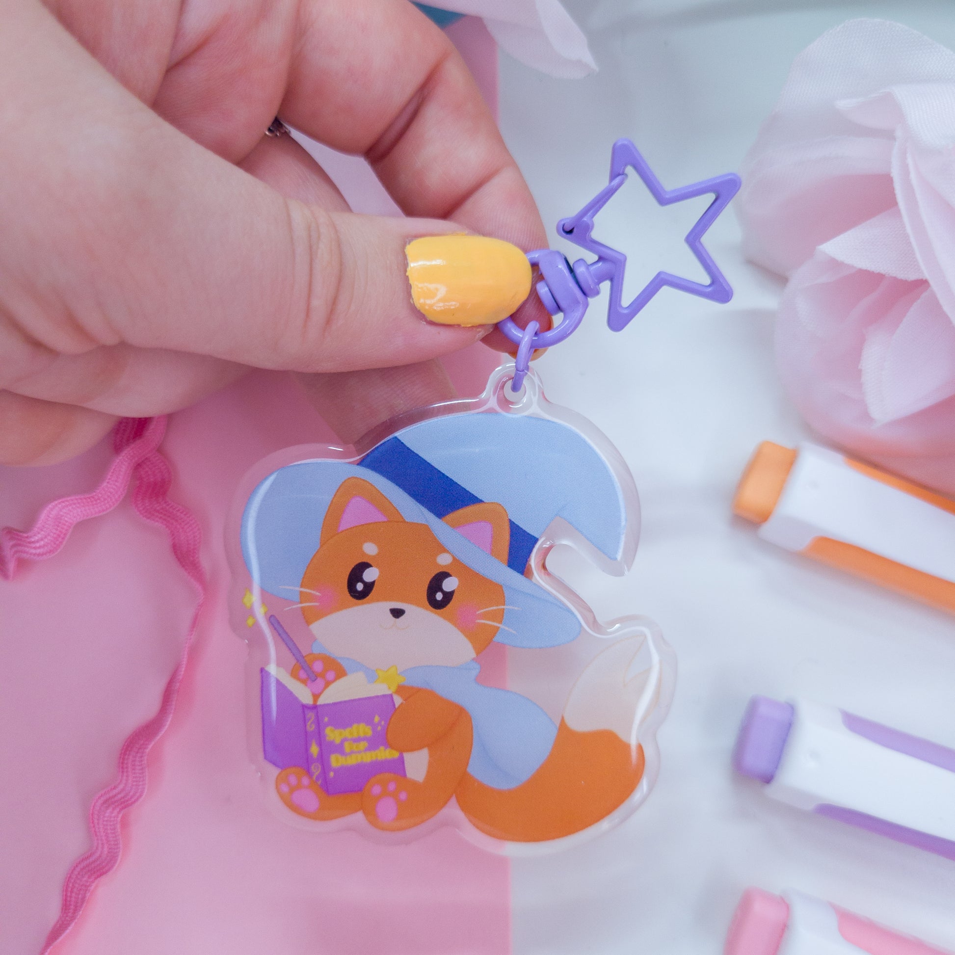 Katrina the kitty witch acryllic keychain with a purple star clasp