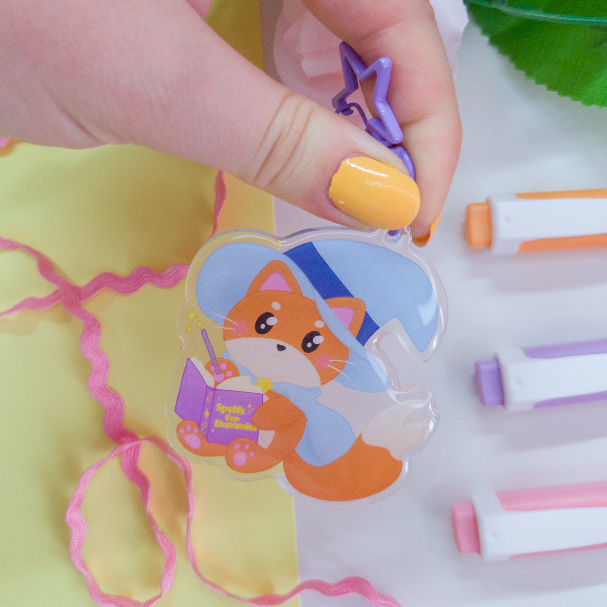 Katrina the kitty witch acryllic keychain with a purple star clasp