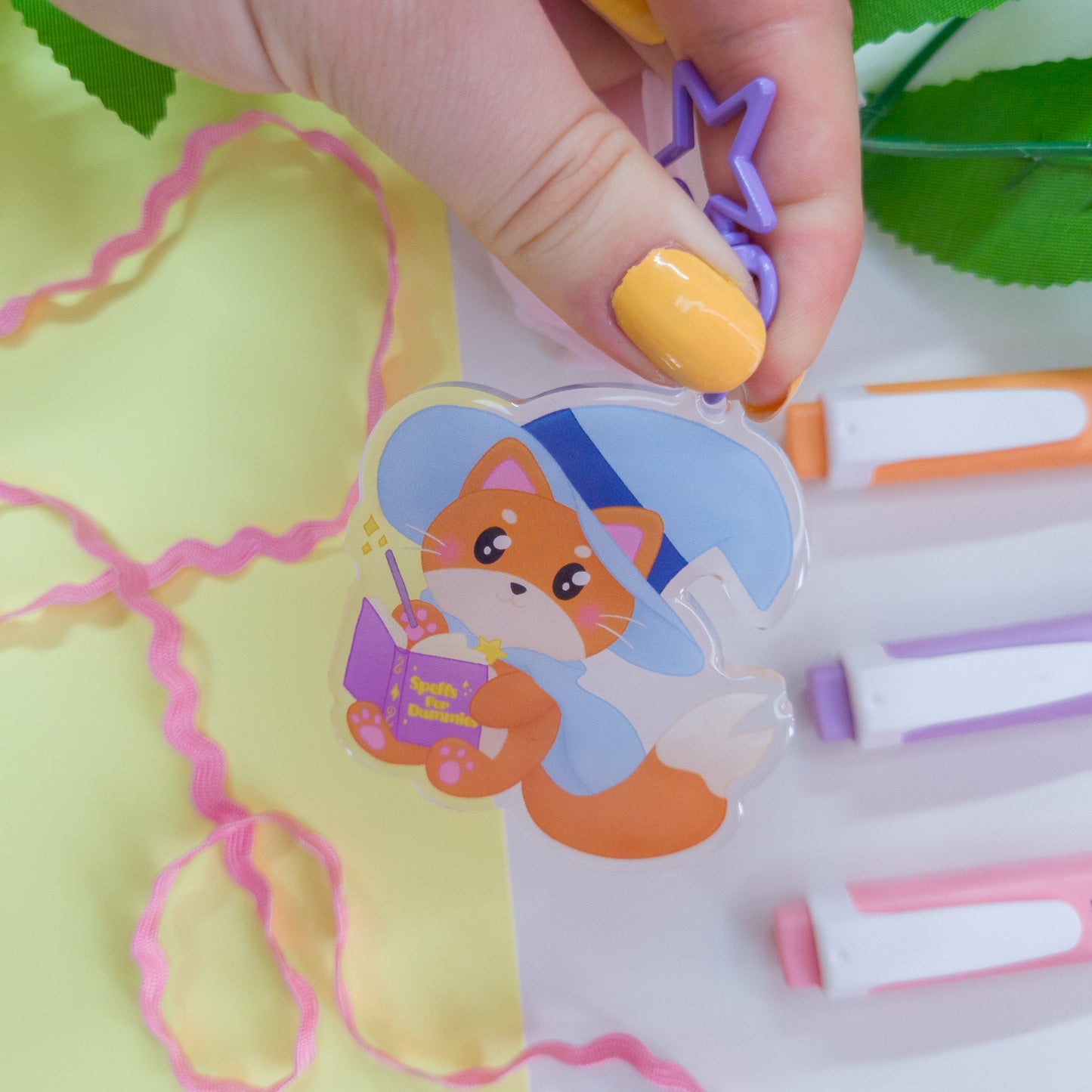 Katrina the kitty witch acryllic keychain with a purple star clasp