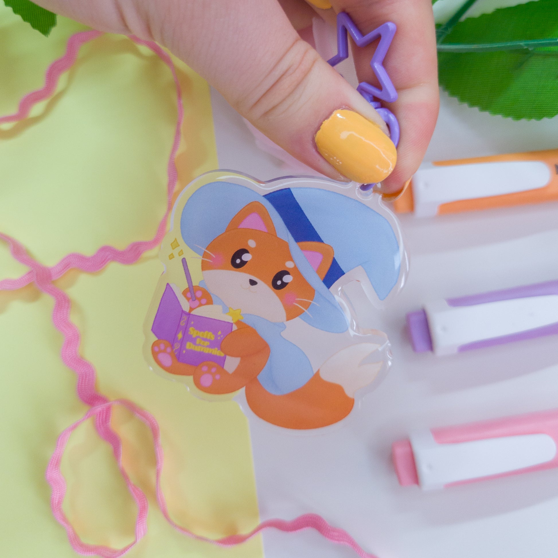 Katrina the kitty witch acryllic keychain with a purple star clasp