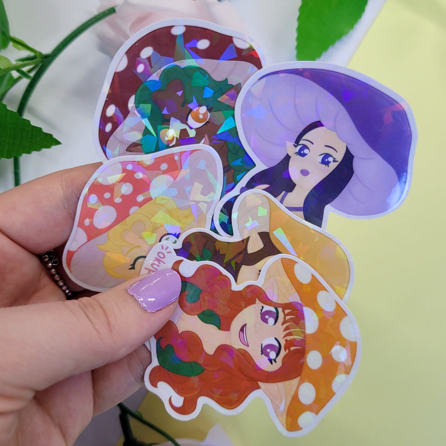 Mushroom Girls Sticker Pack on a planner with a pink flower in the background