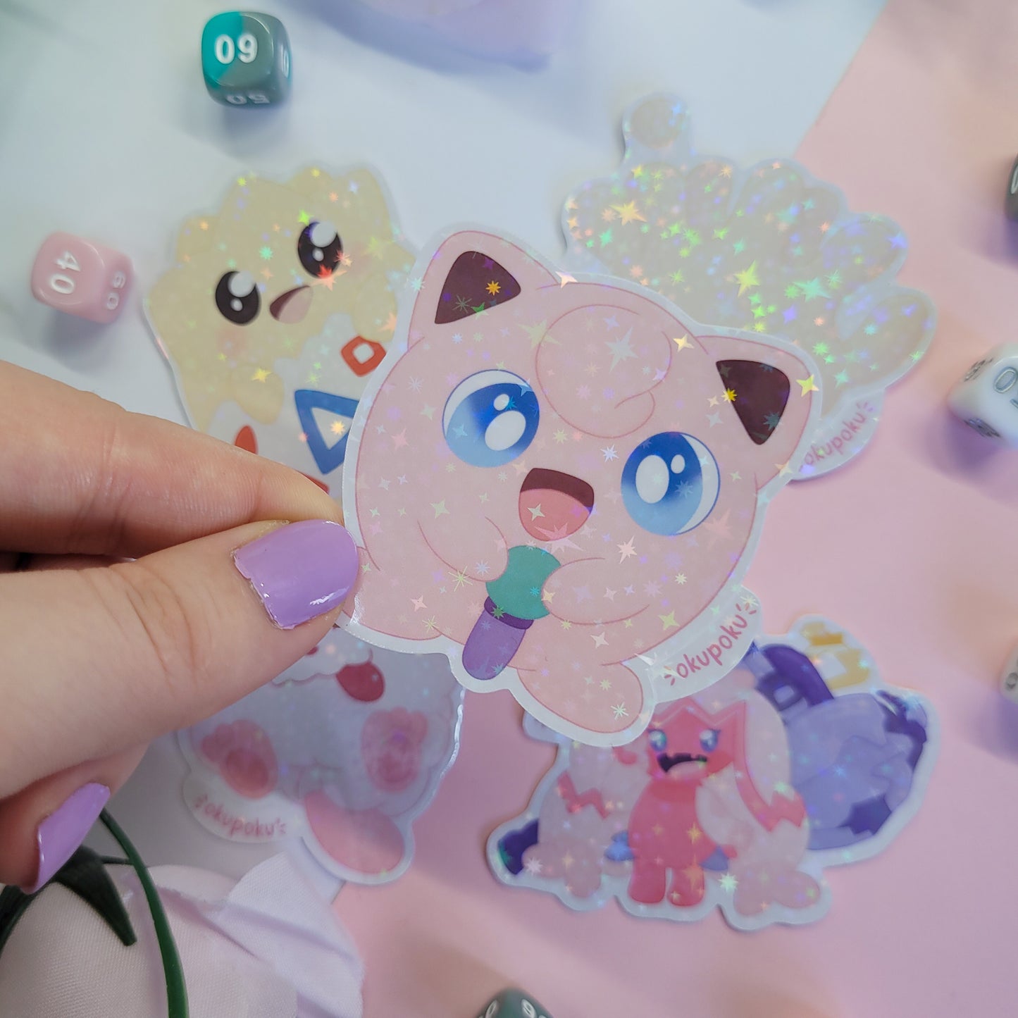 Fairy types stickerpack with a cute character design held by a hand.