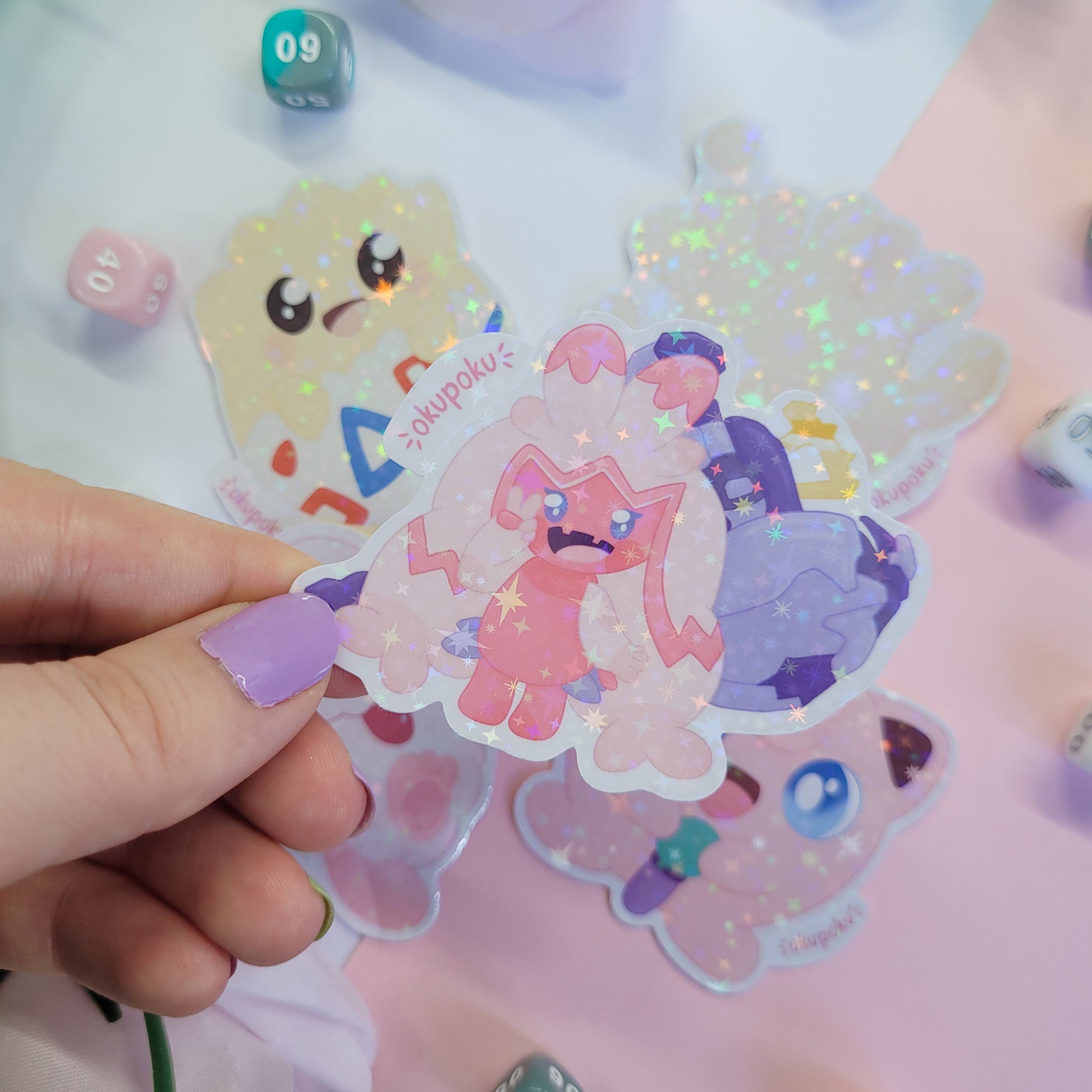 Fairy types stickerpack with a cute character design held by a hand.