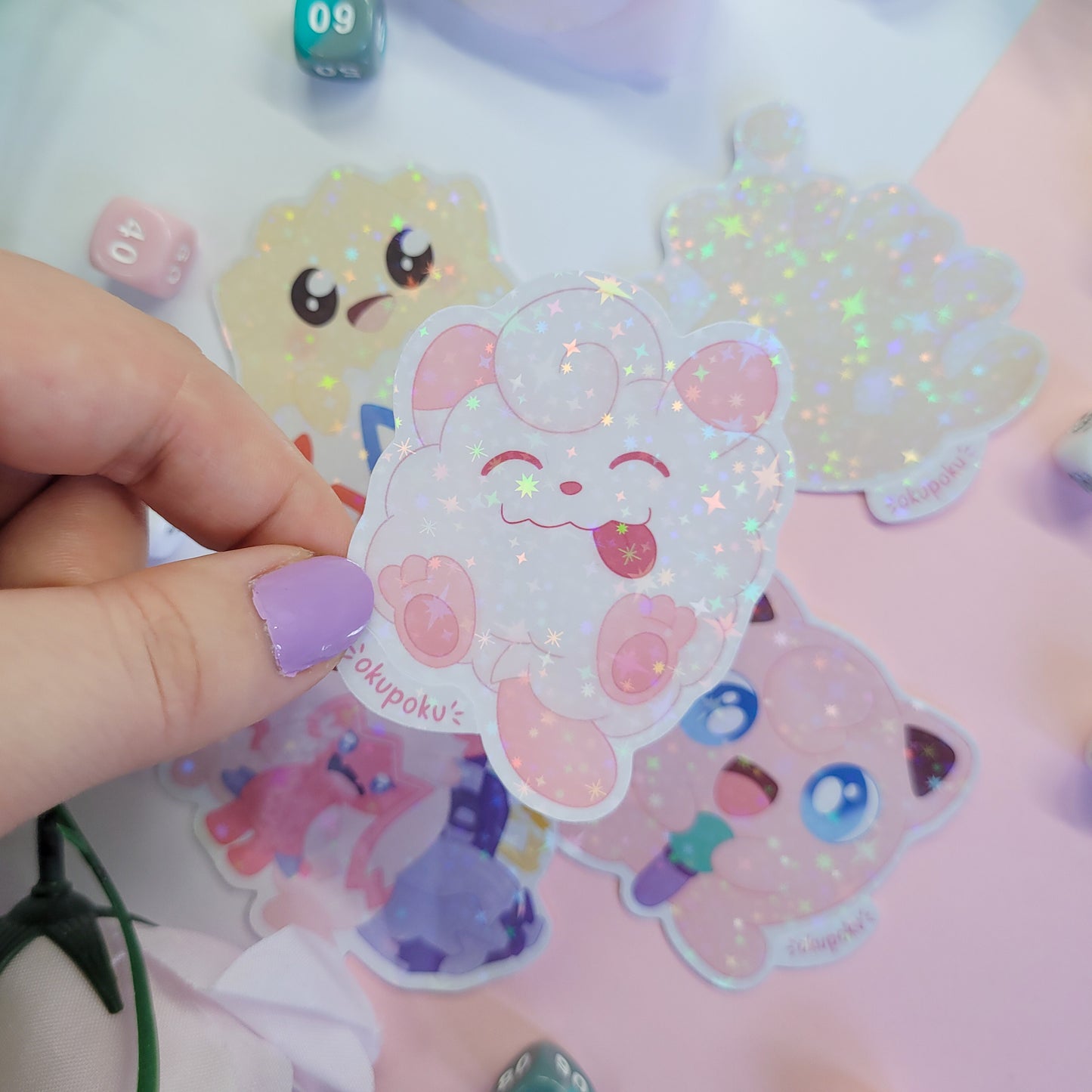 Fairy types stickerpack with a cute character design held by a hand.
