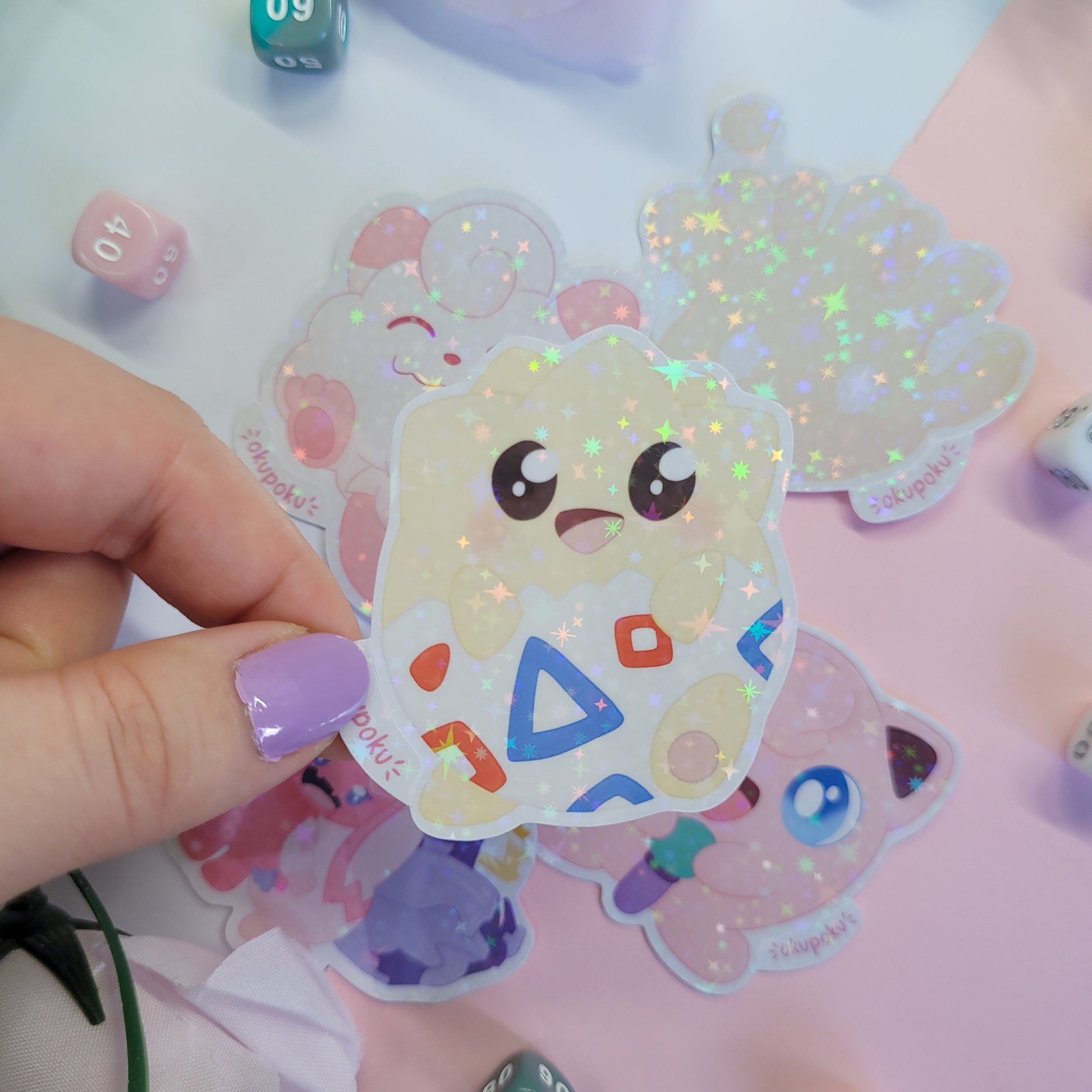 Fairy types stickerpack with a cute character design held by a hand.