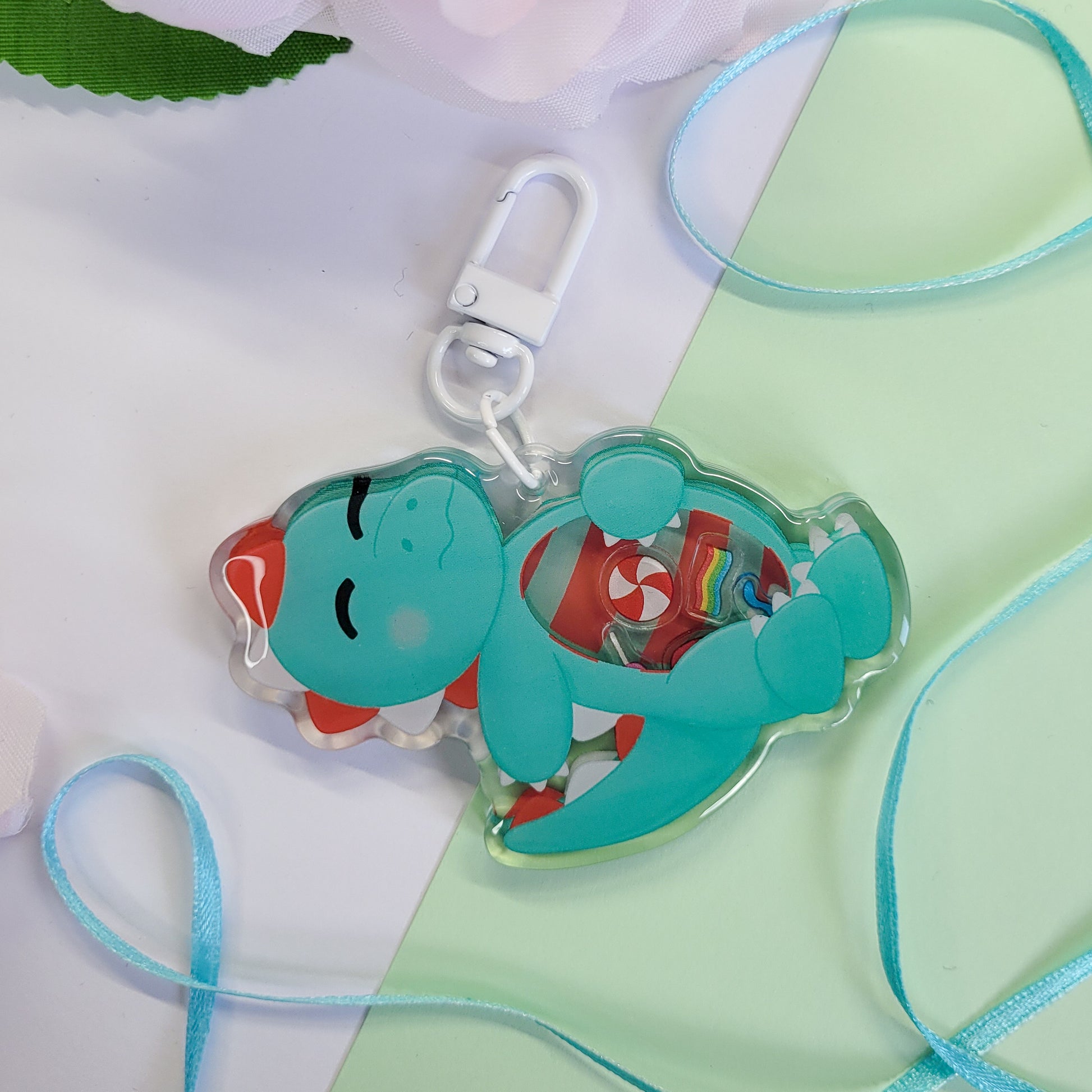 Peppermint T-Rex shaker keychain with a belly full of sweets