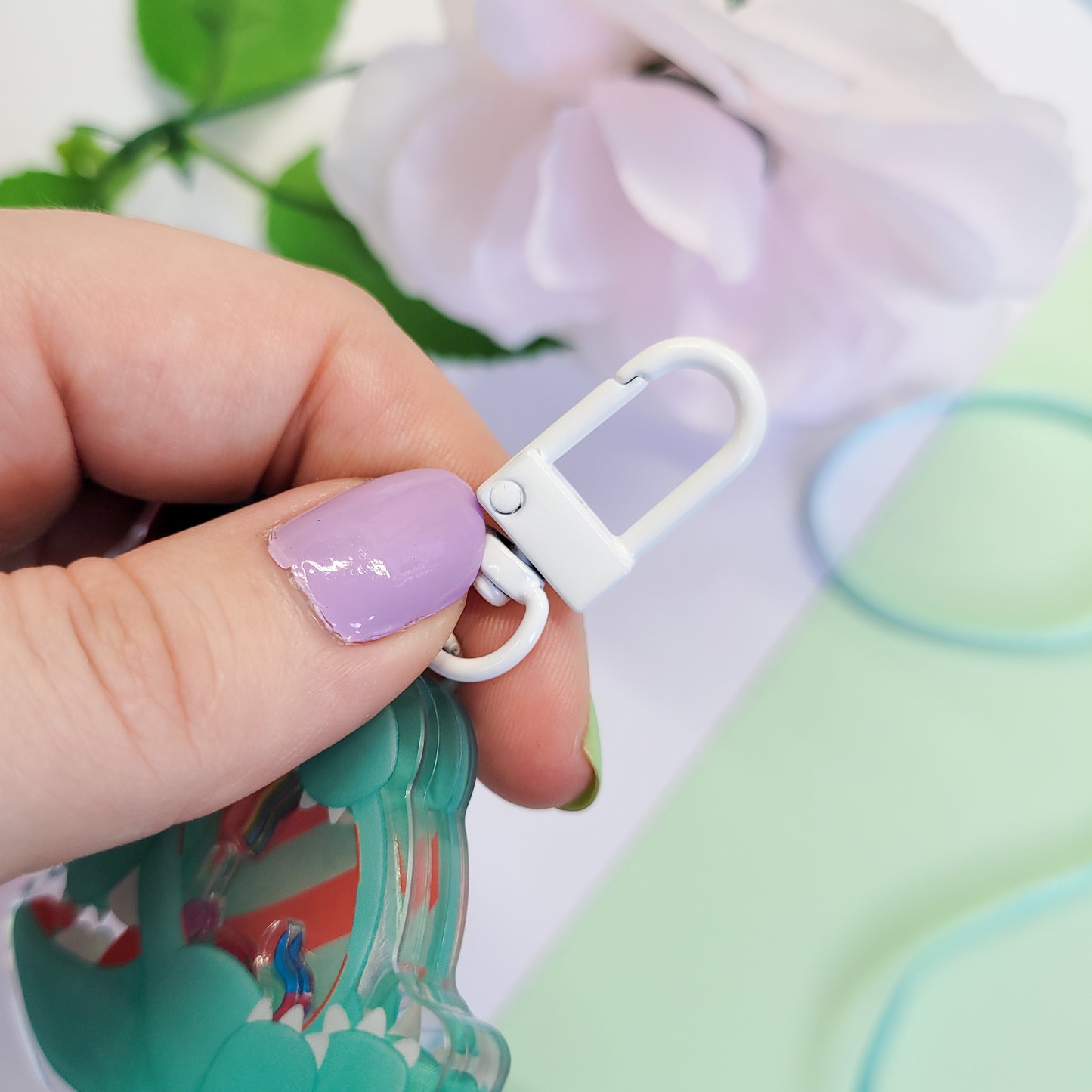 Peppermint T-Rex shaker keychain with a belly full of sweets