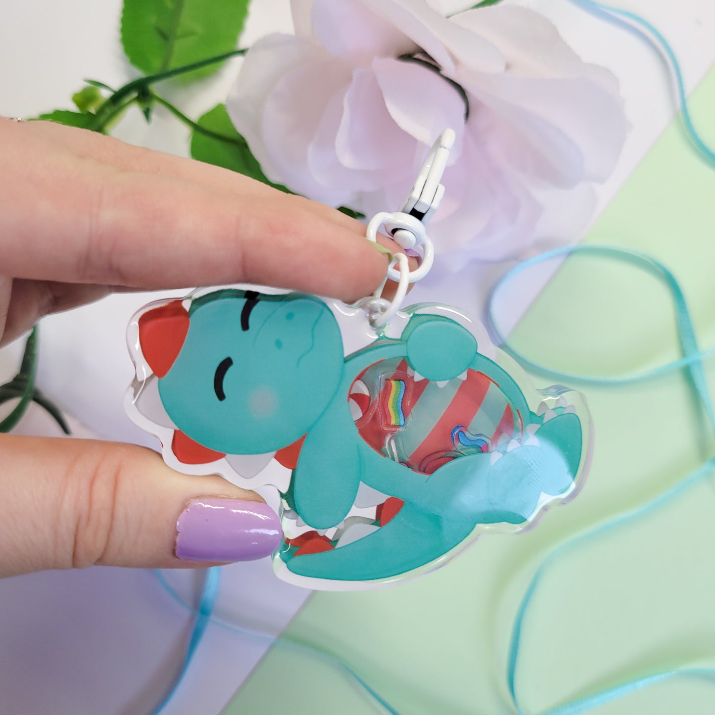 Peppermint T-Rex shaker keychain with a belly full of sweets