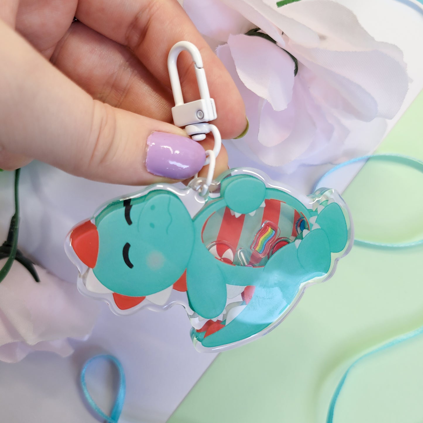 Peppermint T-Rex shaker keychain with a belly full of sweets