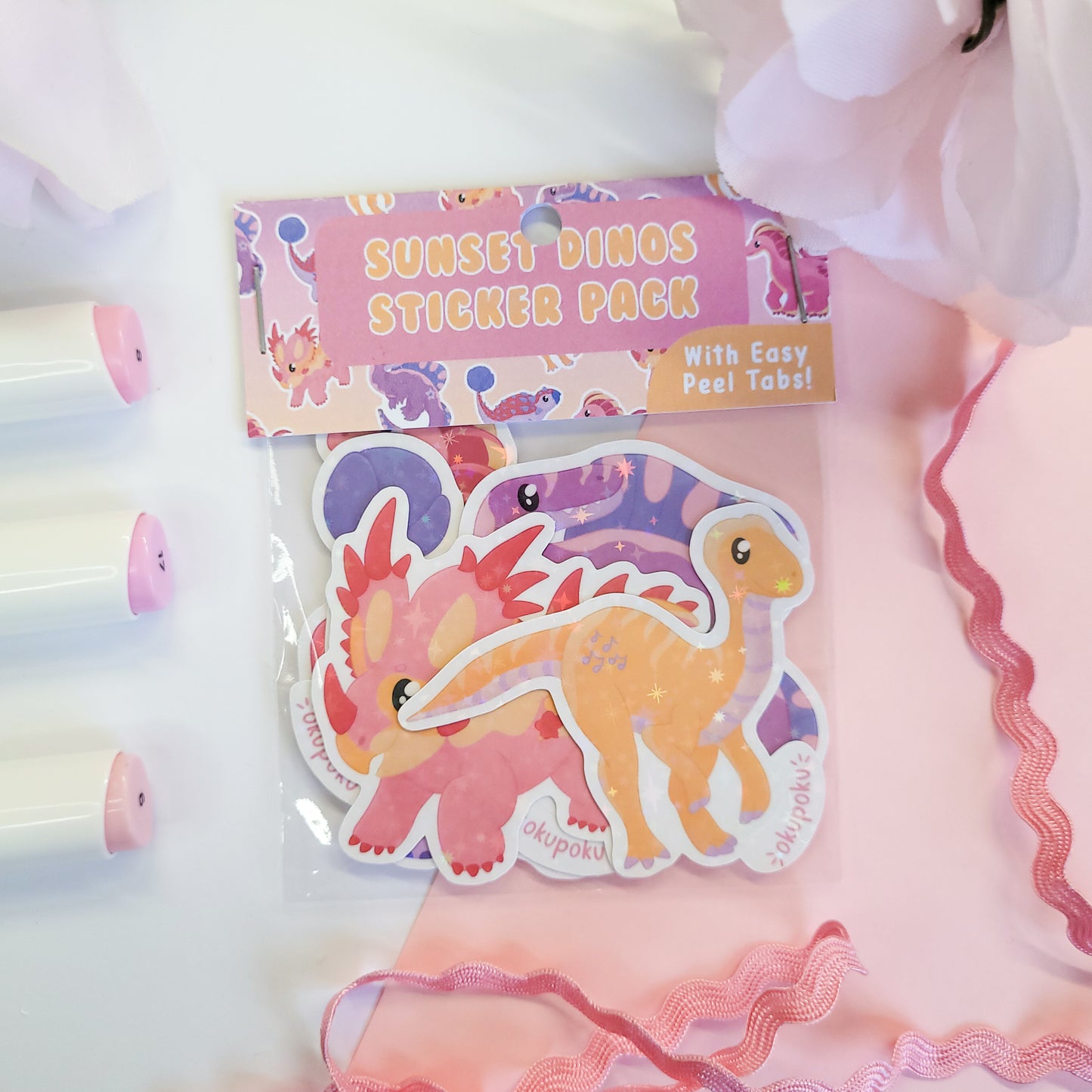 Packaged sticker with dinosaur design on a white background