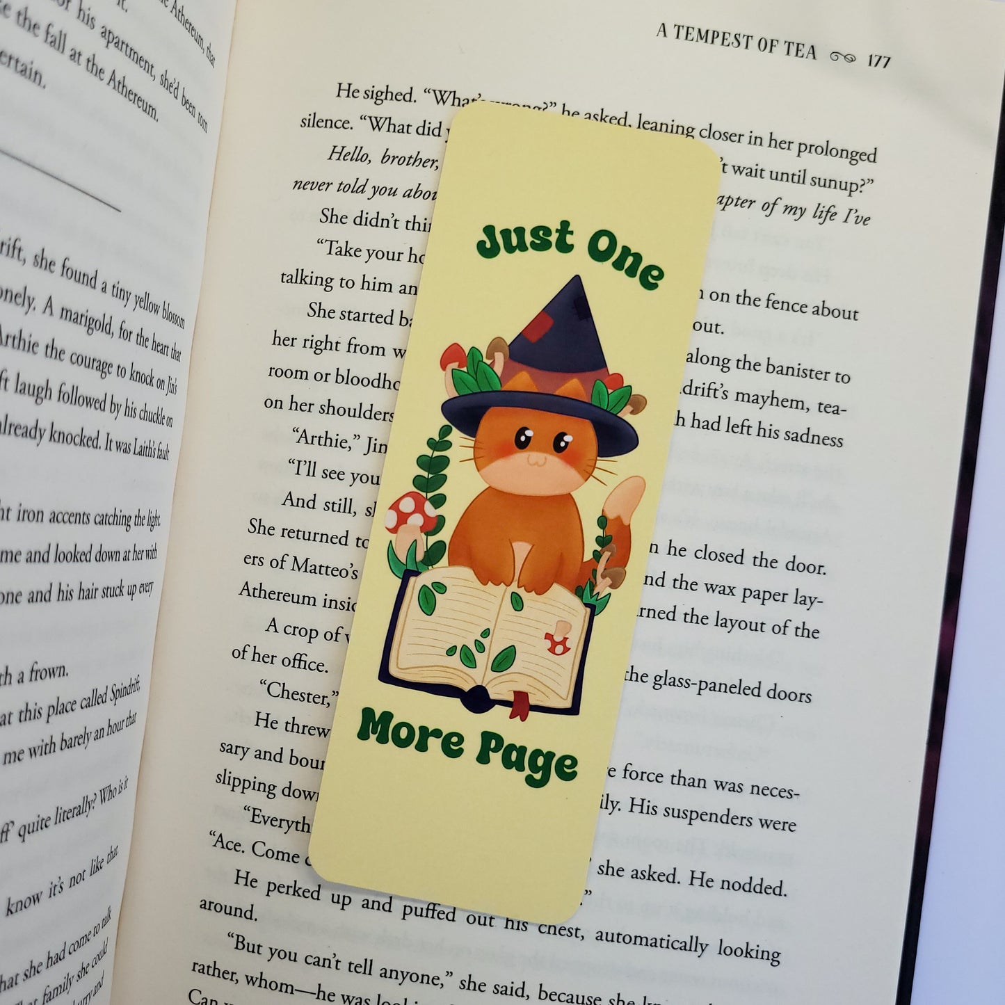 Cute cat witch bookmark featuring the text "Just one more page"