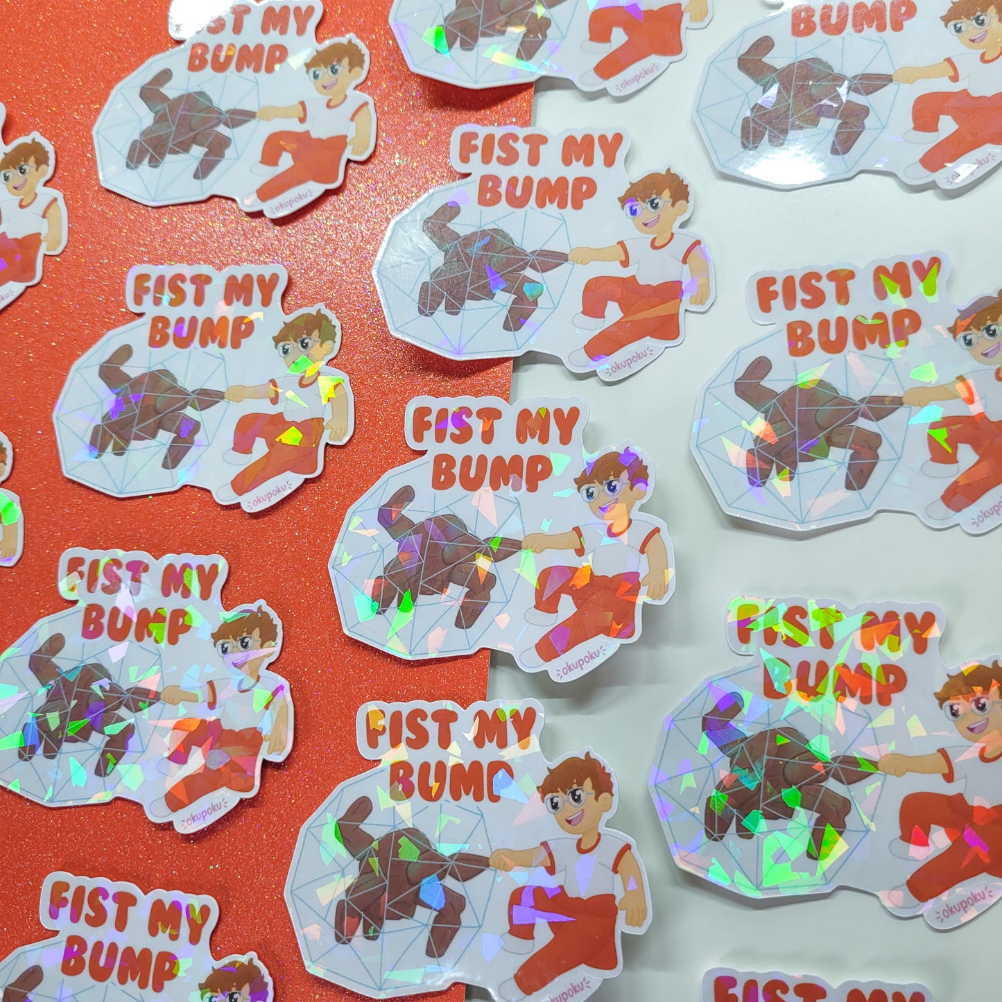 Holographic stickers with rocky and grace and text 'Fist My Bump' on a red background