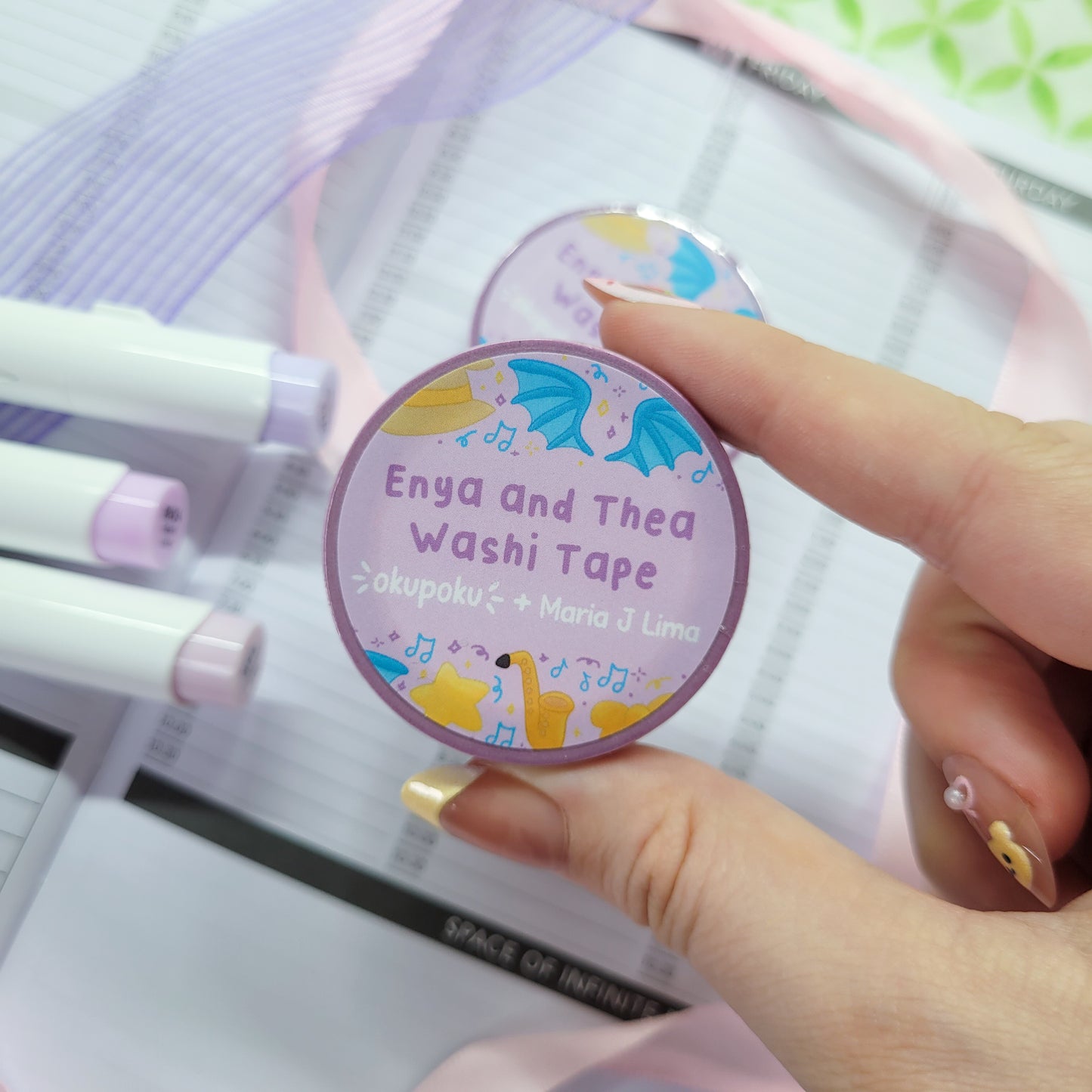 Enya and thea washi tape shown on a journal