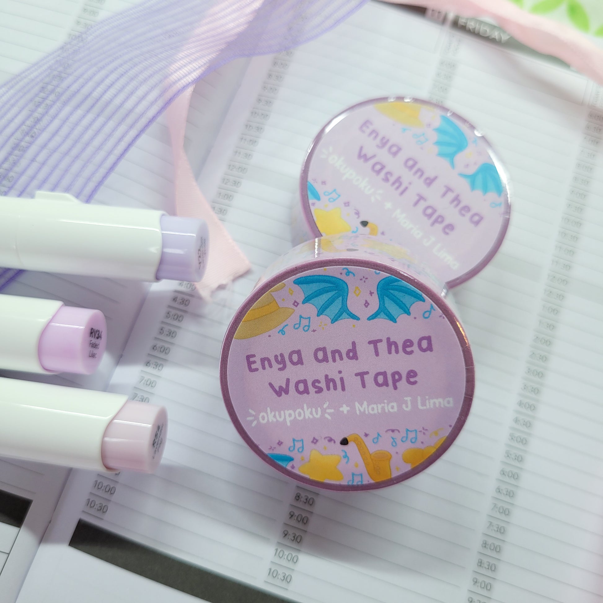 Enya and thea washi tape shown on a journal