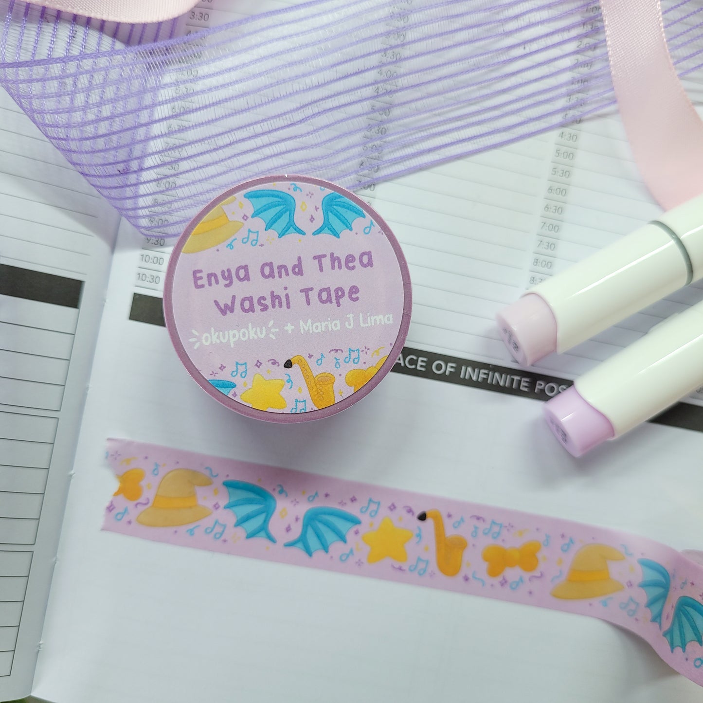 Enya and thea washi tape shown on a journal