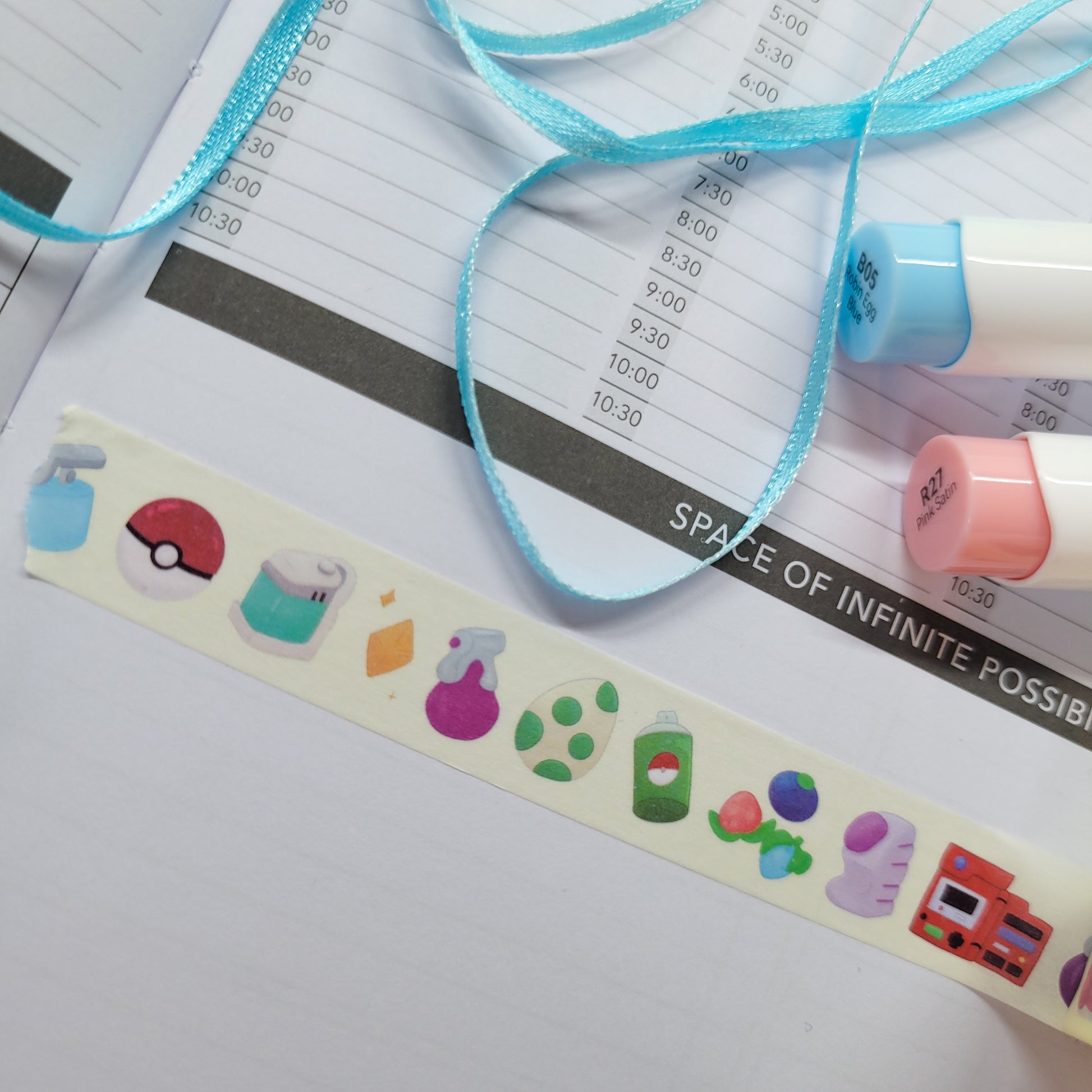 Pokemon Item washi tape being shown in a journal