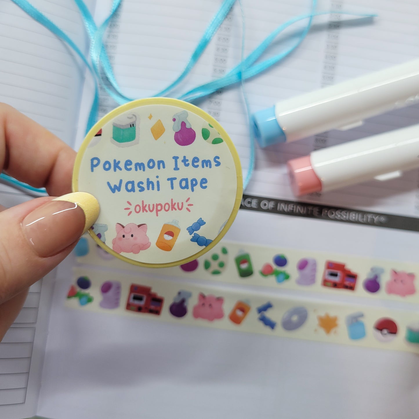 Pokemon Item washi tape being shown in a journal