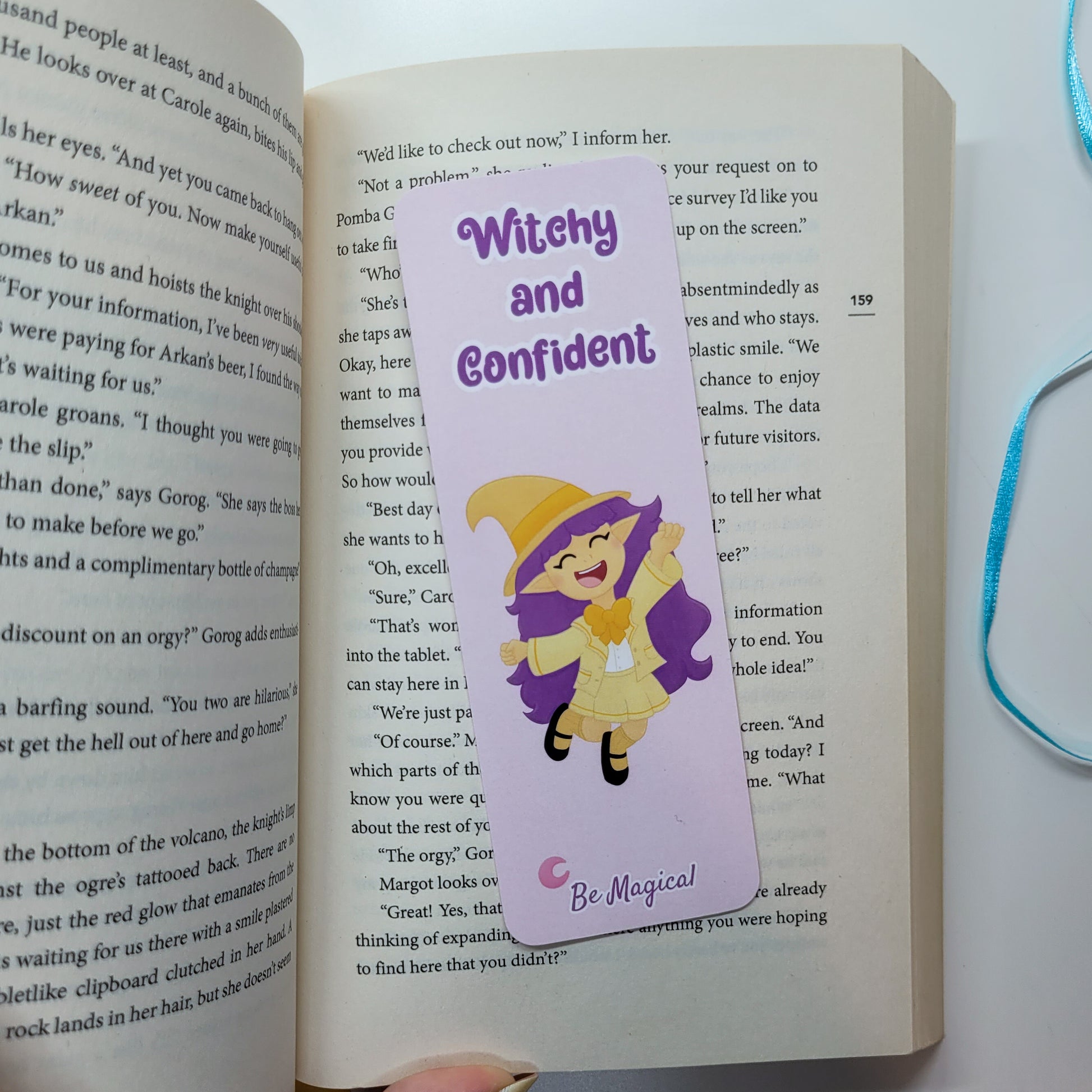 little witch on a bookmark with text witchy and confident