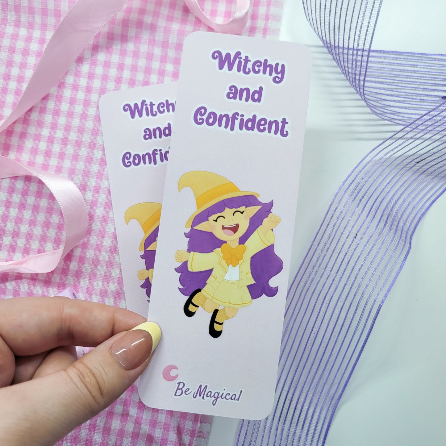 little witch on a bookmark with text witchy and confident