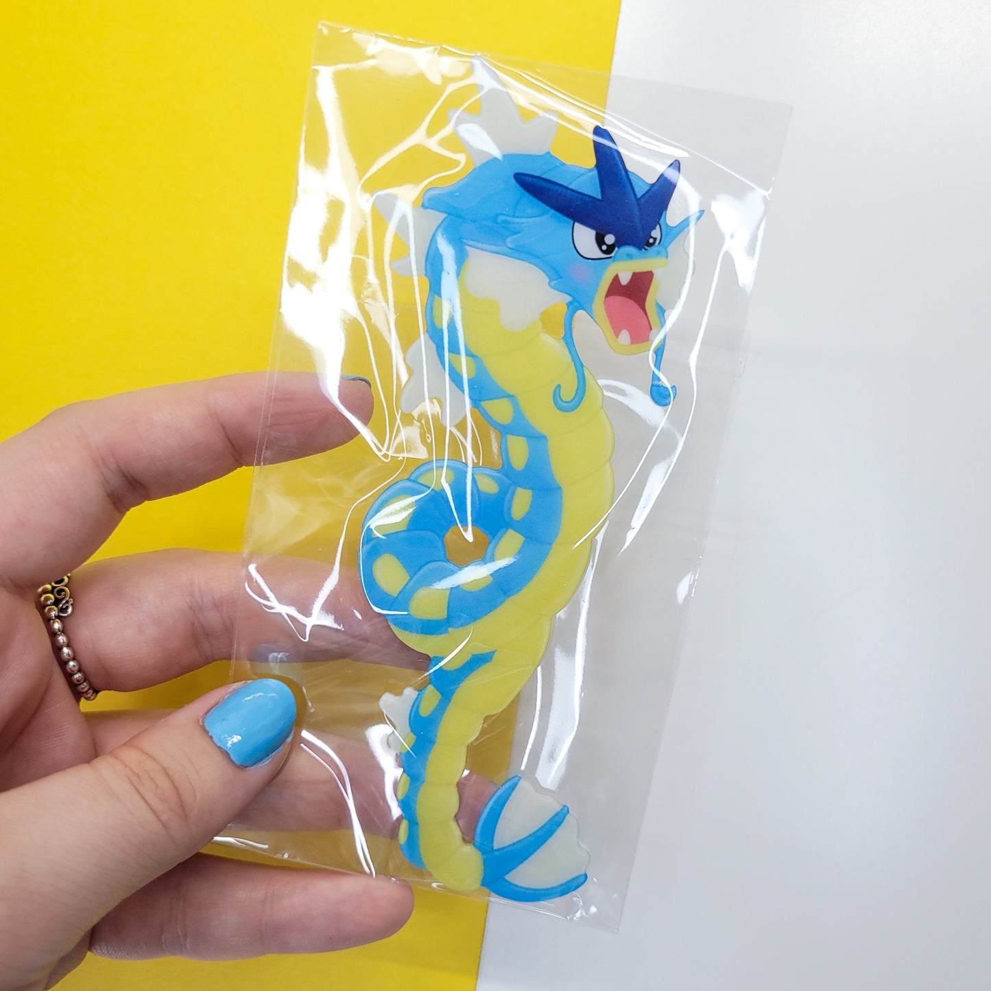 Gyrados shaped bookmark shown in use