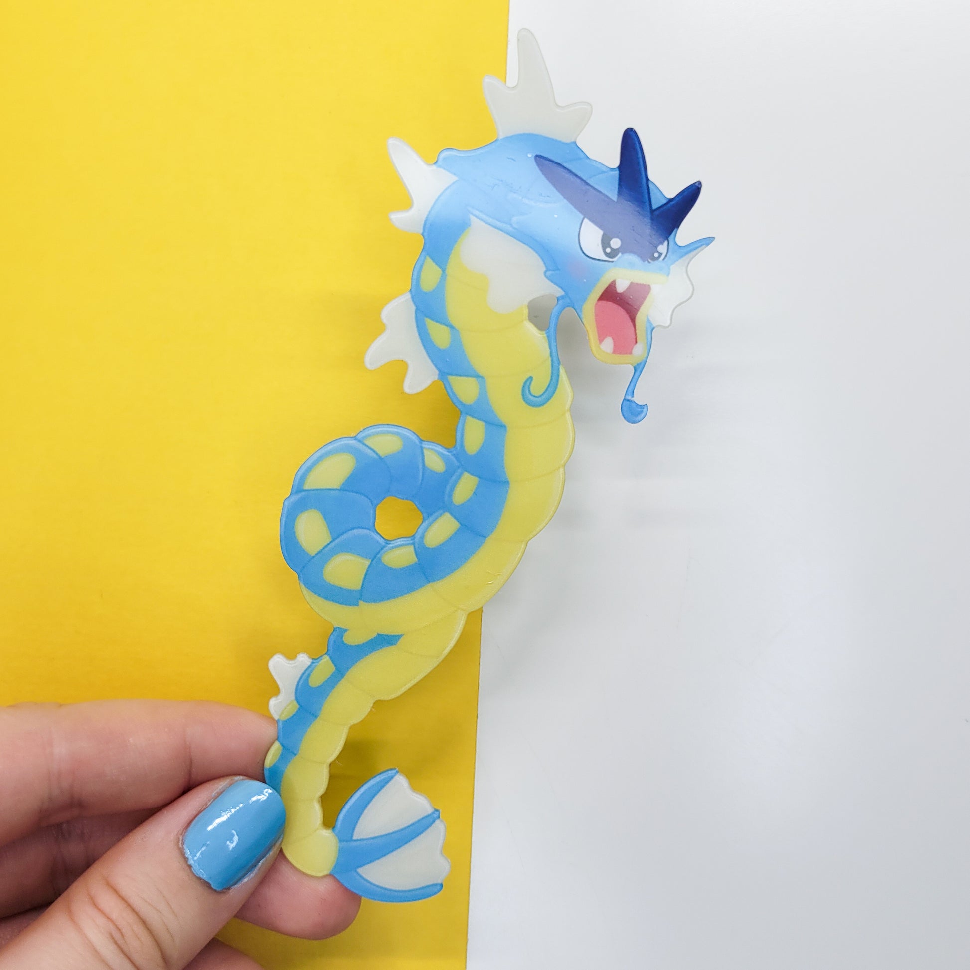 Gyrados shaped bookmark shown in use