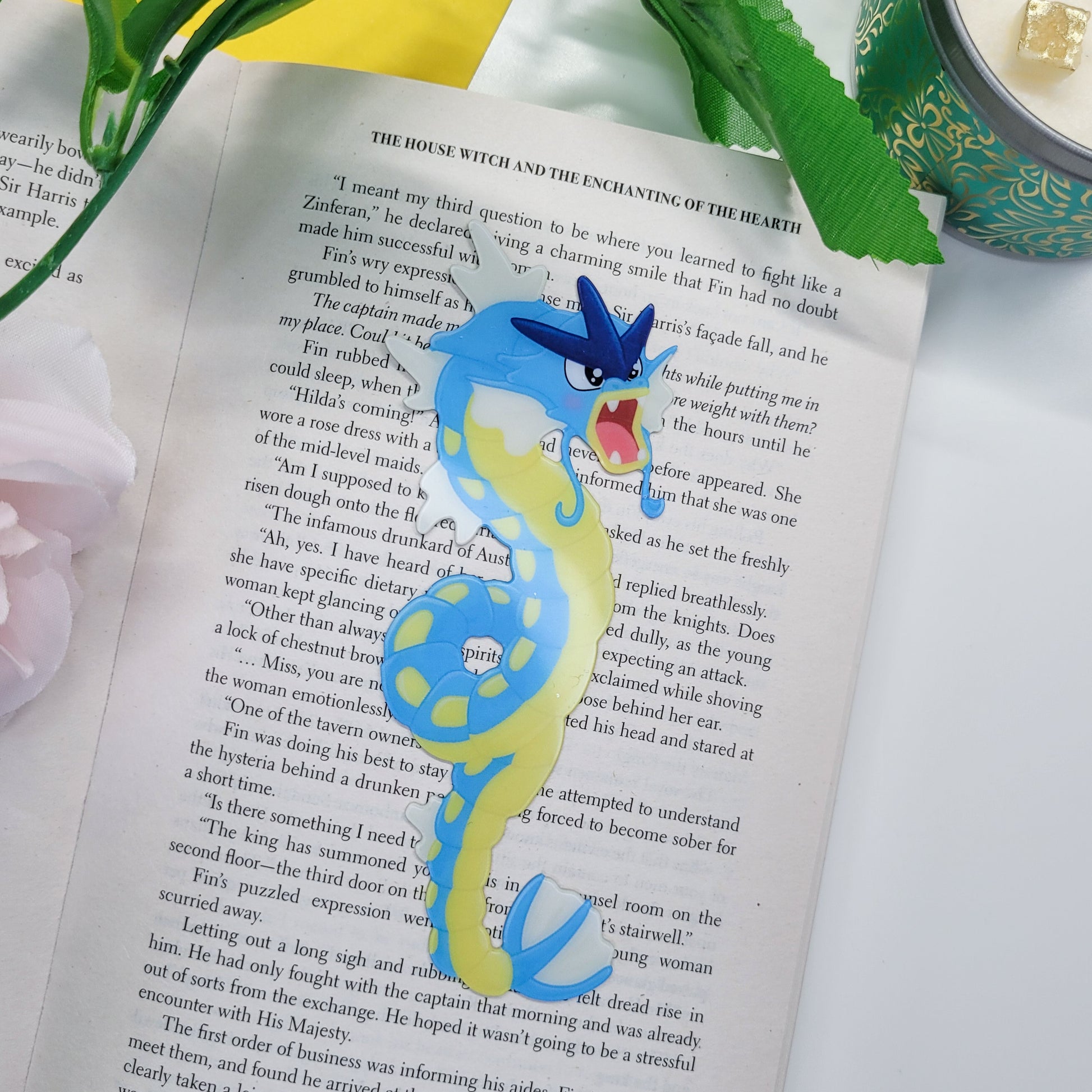Gyrados shaped bookmark shown in use