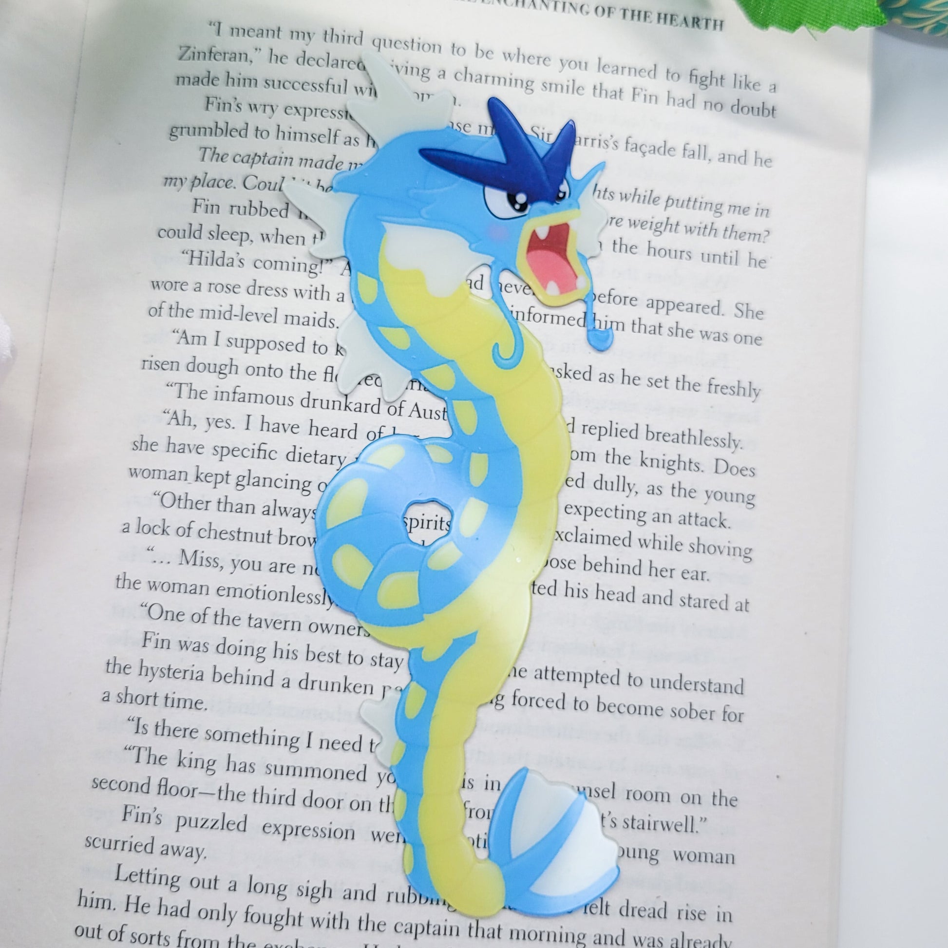Gyrados shaped bookmark shown in use