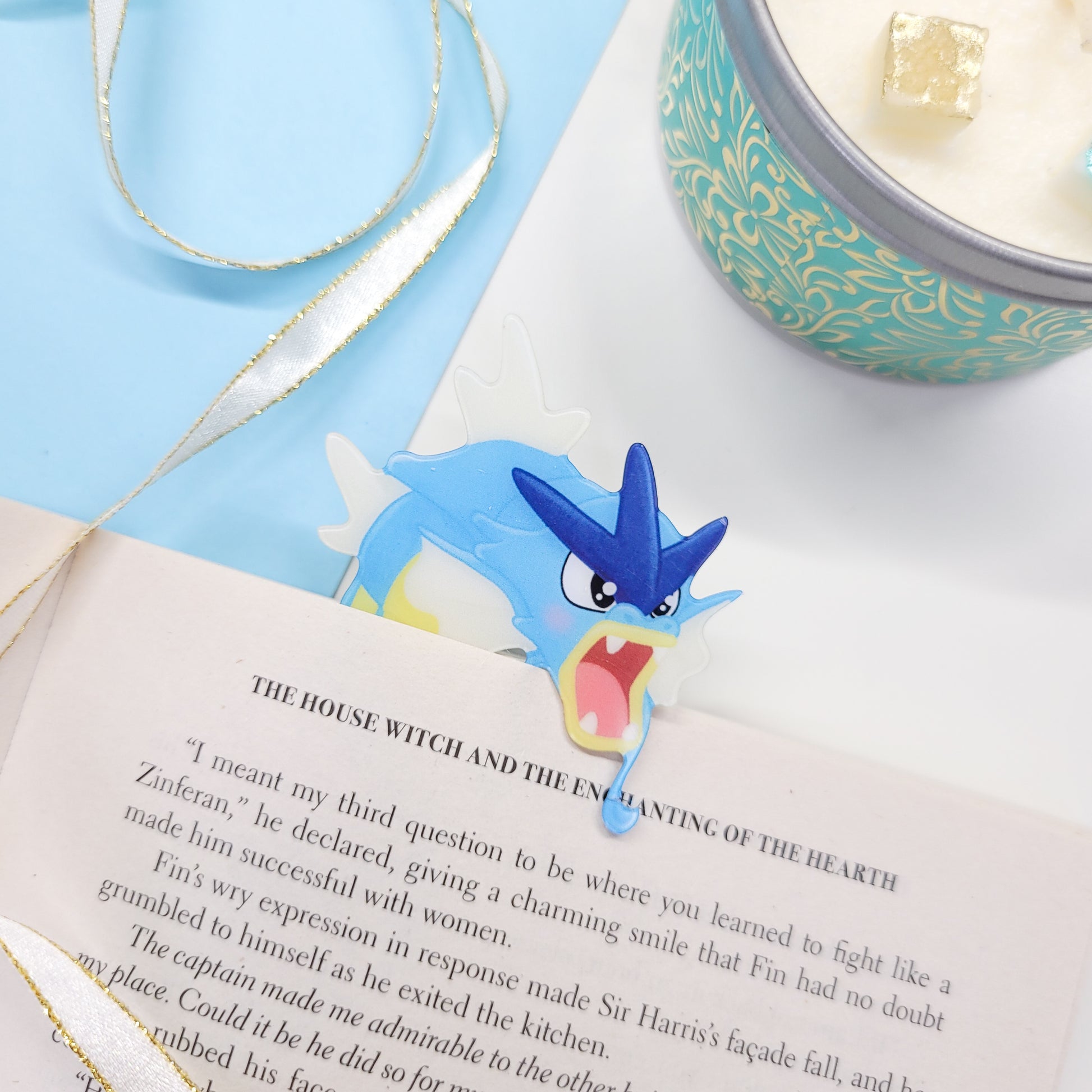 Gyrados shaped bookmark shown in use