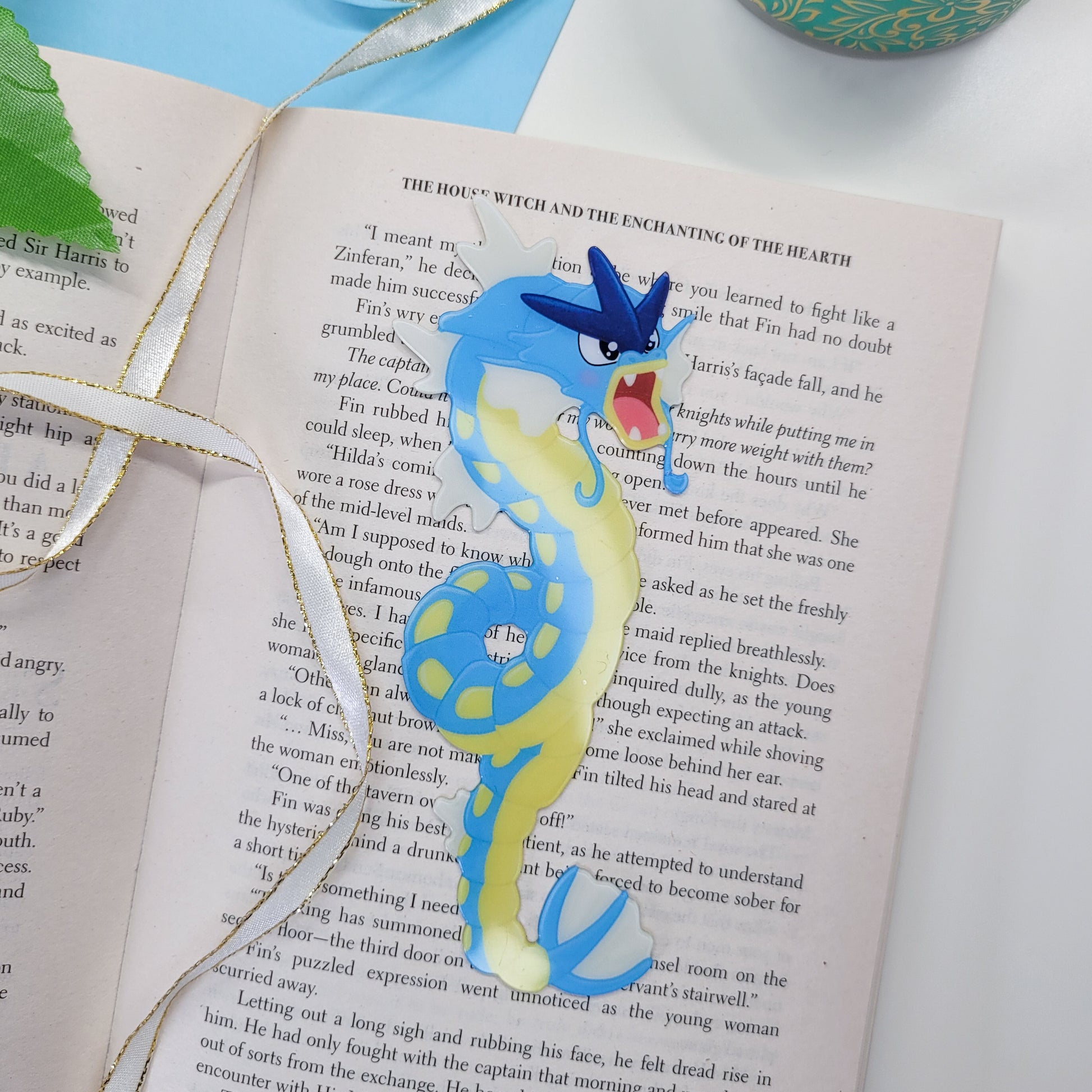 Gyrados shaped bookmark shown in use