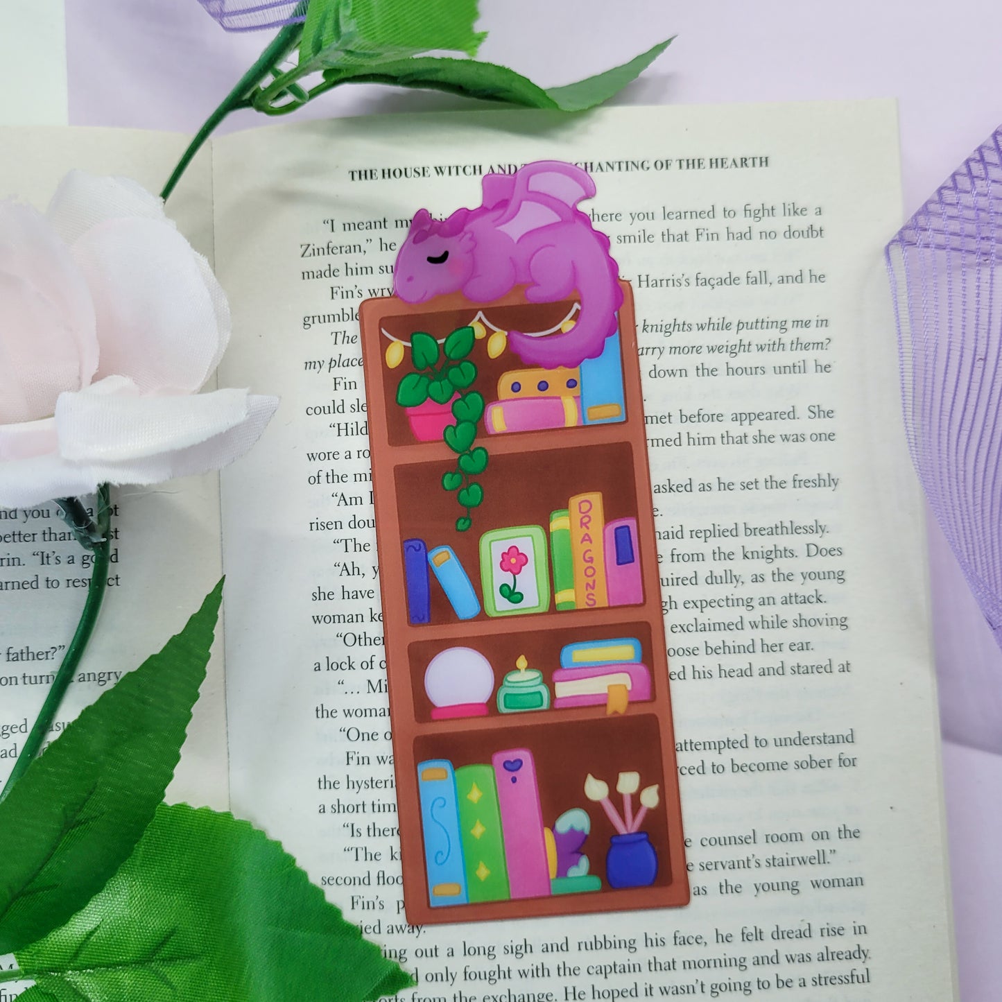 Magical bookshelf with Purple dragon sat on top