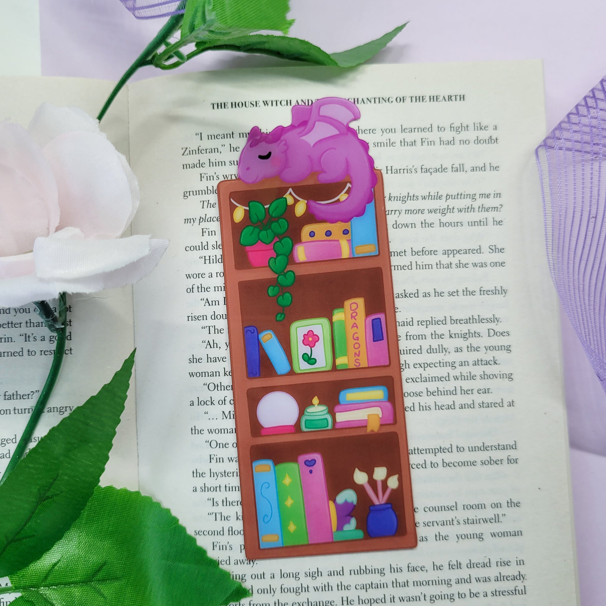 Magical bookshelf with Purple dragon sat on top