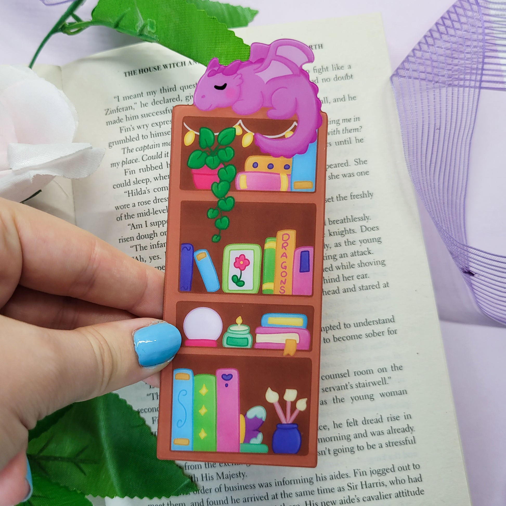 Magical bookshelf with Purple dragon sat on top