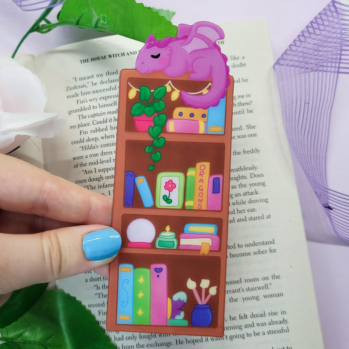 Magical bookshelf with Purple dragon sat on top