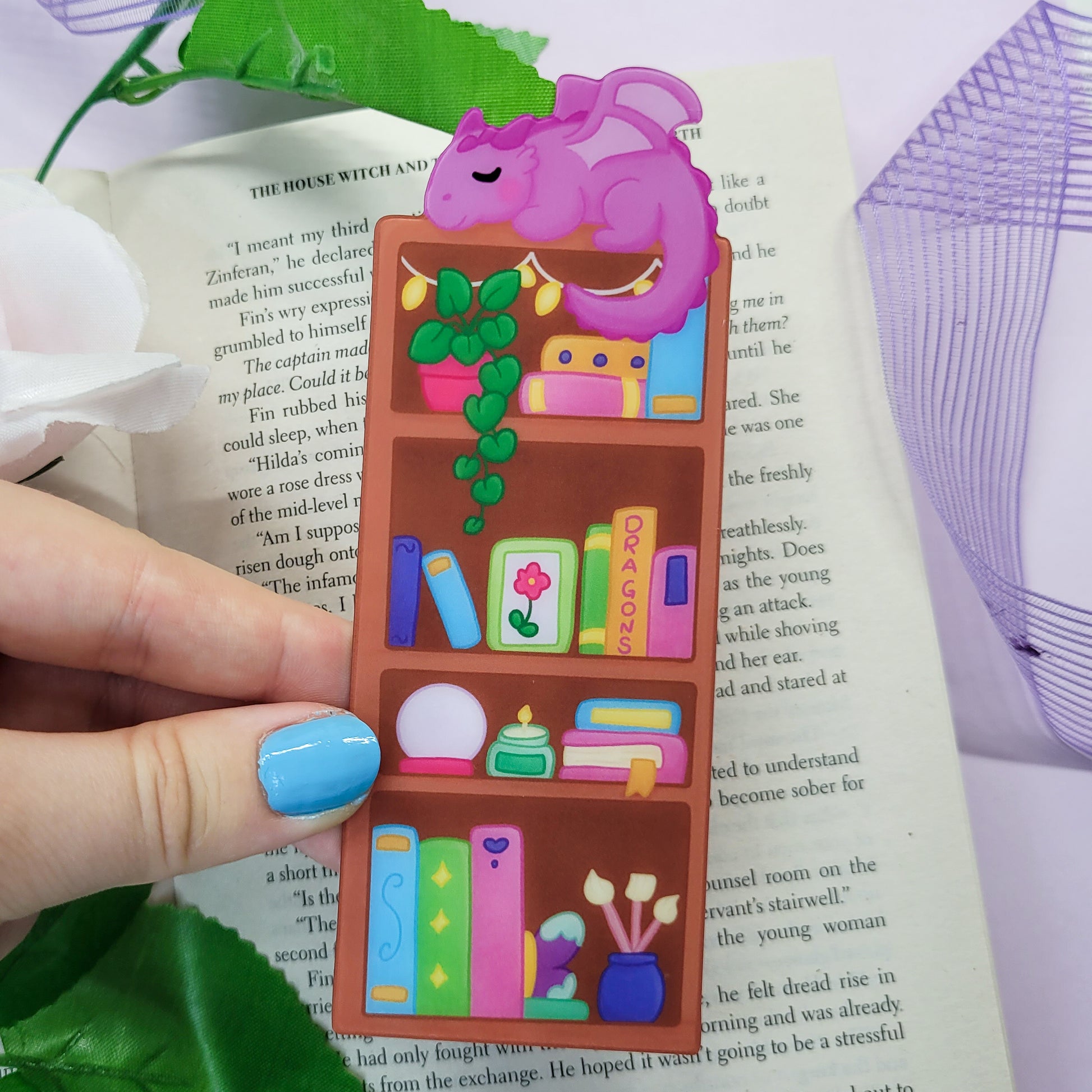 Magical bookshelf with Purple dragon sat on top