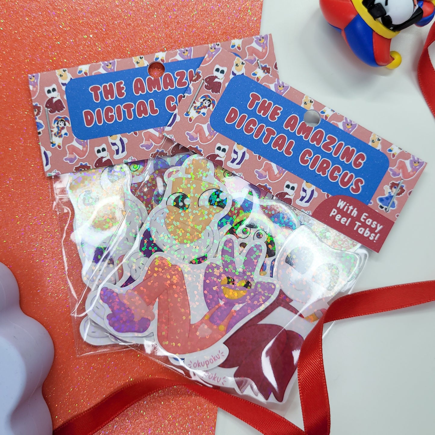 The Amazing Digital Circus sticker pack featuring the main six characters shown in use