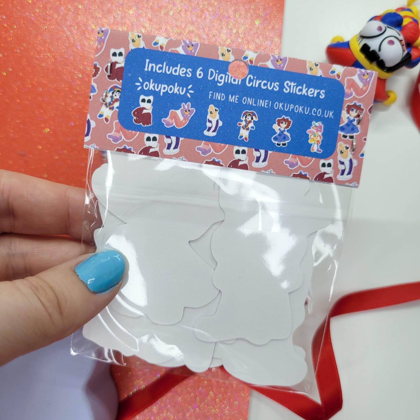 The Amazing Digital Circus sticker pack featuring the main six characters shown in use