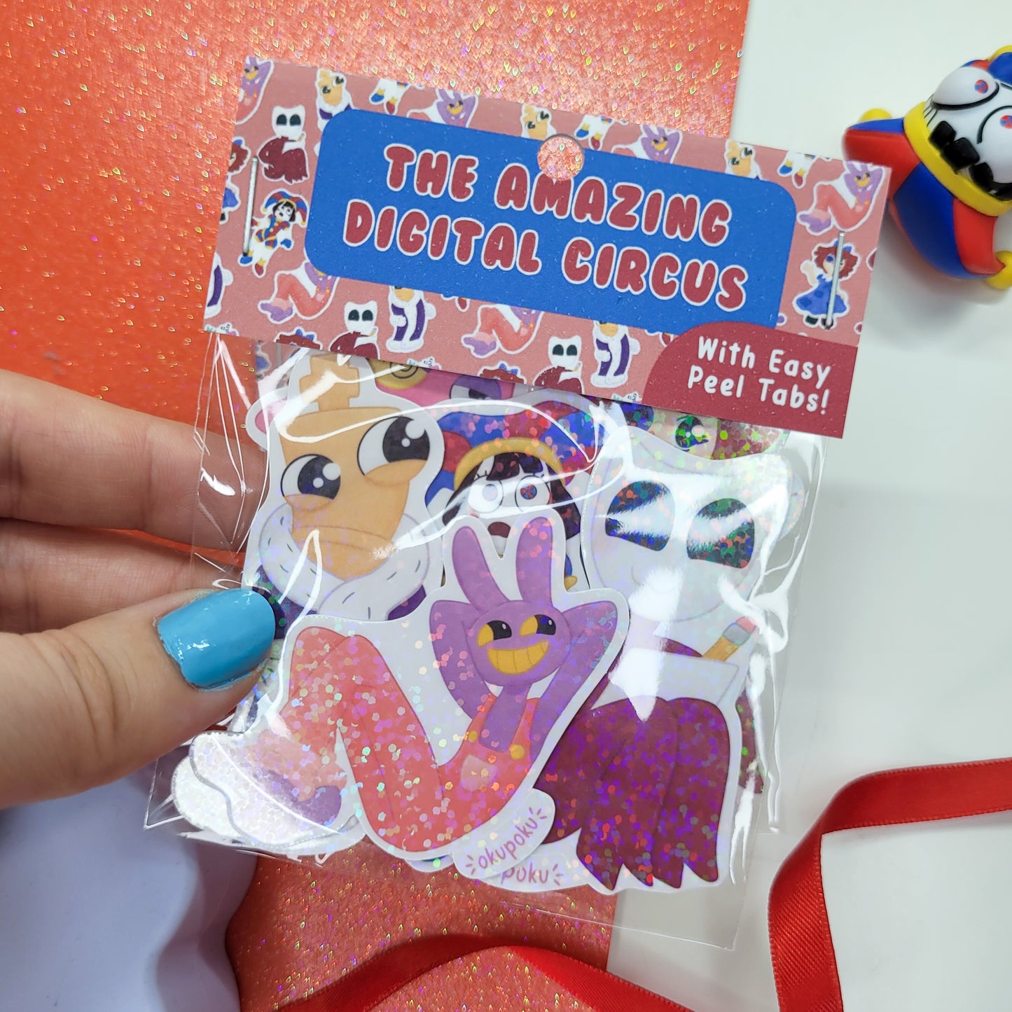 The Amazing Digital Circus sticker pack featuring the main six characters shown in use